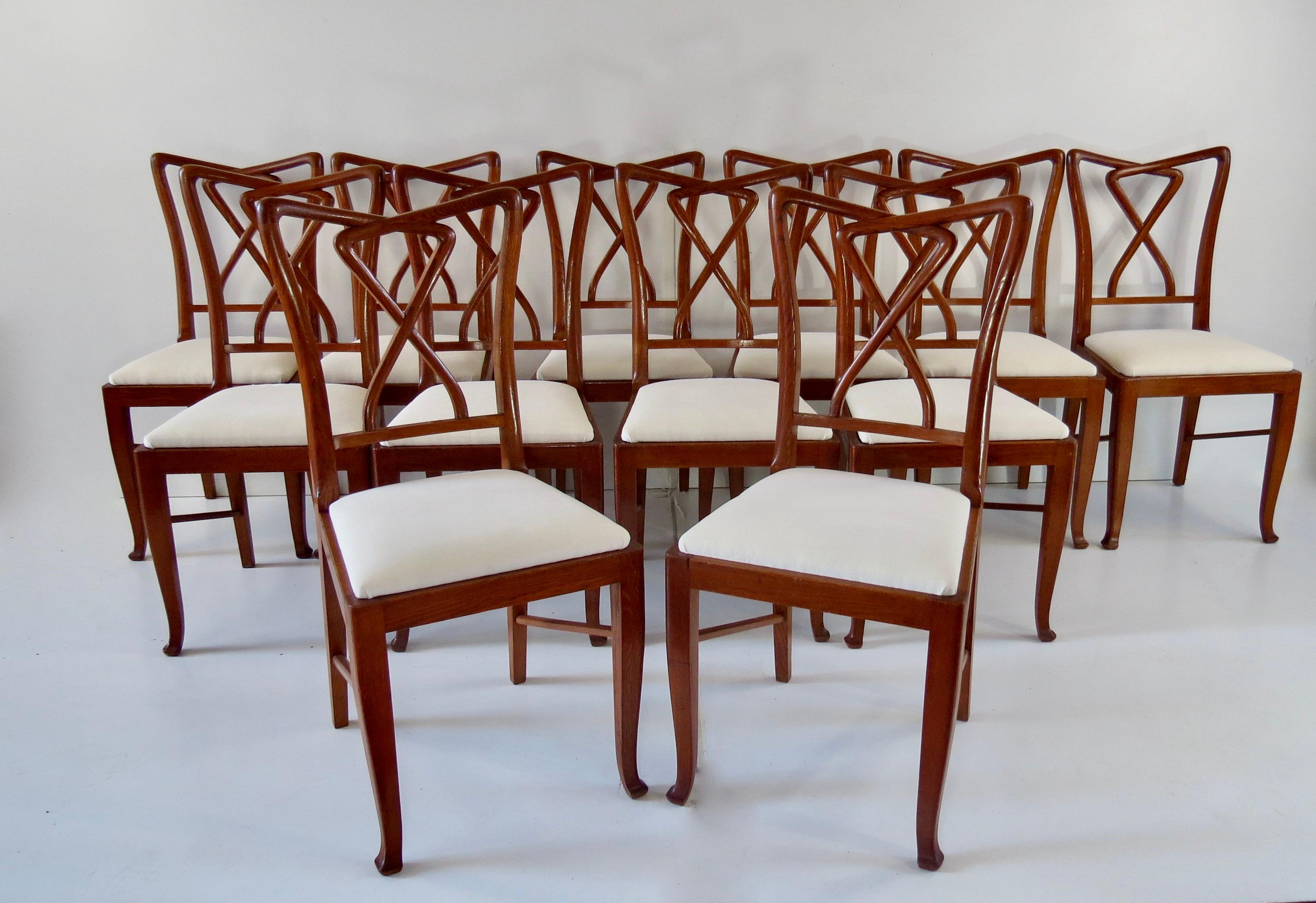 Exceptional set of 12 walnut dining chairs attributed to Paolo Buffa, 1950.
very rare set of 12 chairs produced for a private residence in Milan
details typical for Buffa's craftsmanship include the bow shaped patterns on the backrests.
The