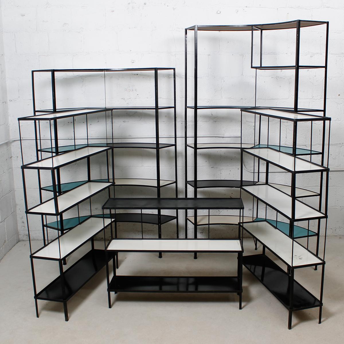 Set of Rare Multi-Color Curved Shelving Units by Frederick Weinberg

Additional information:
Material: Iron
Very cool, very ’50s-evocative modular bookshelf system in iron by Frederick Weinberg.
Manufactured in iron, these units detach and fit