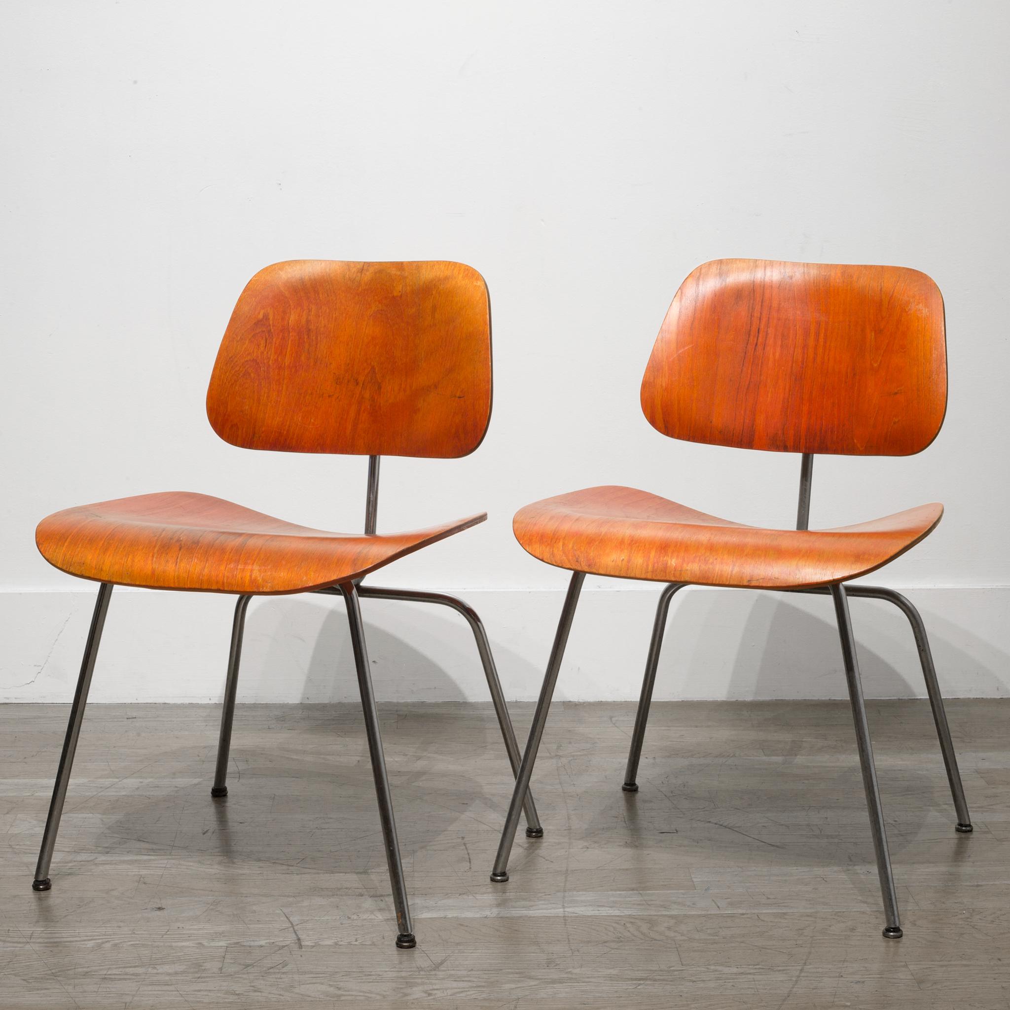 About

This is a rare set of red aniline early Herman Miller DCM, possibly Evans, with walnut veneer seat and back with metal legs. All chairs have the original feet. These chairs are fabricated from molded plywood seats and backs attached to a