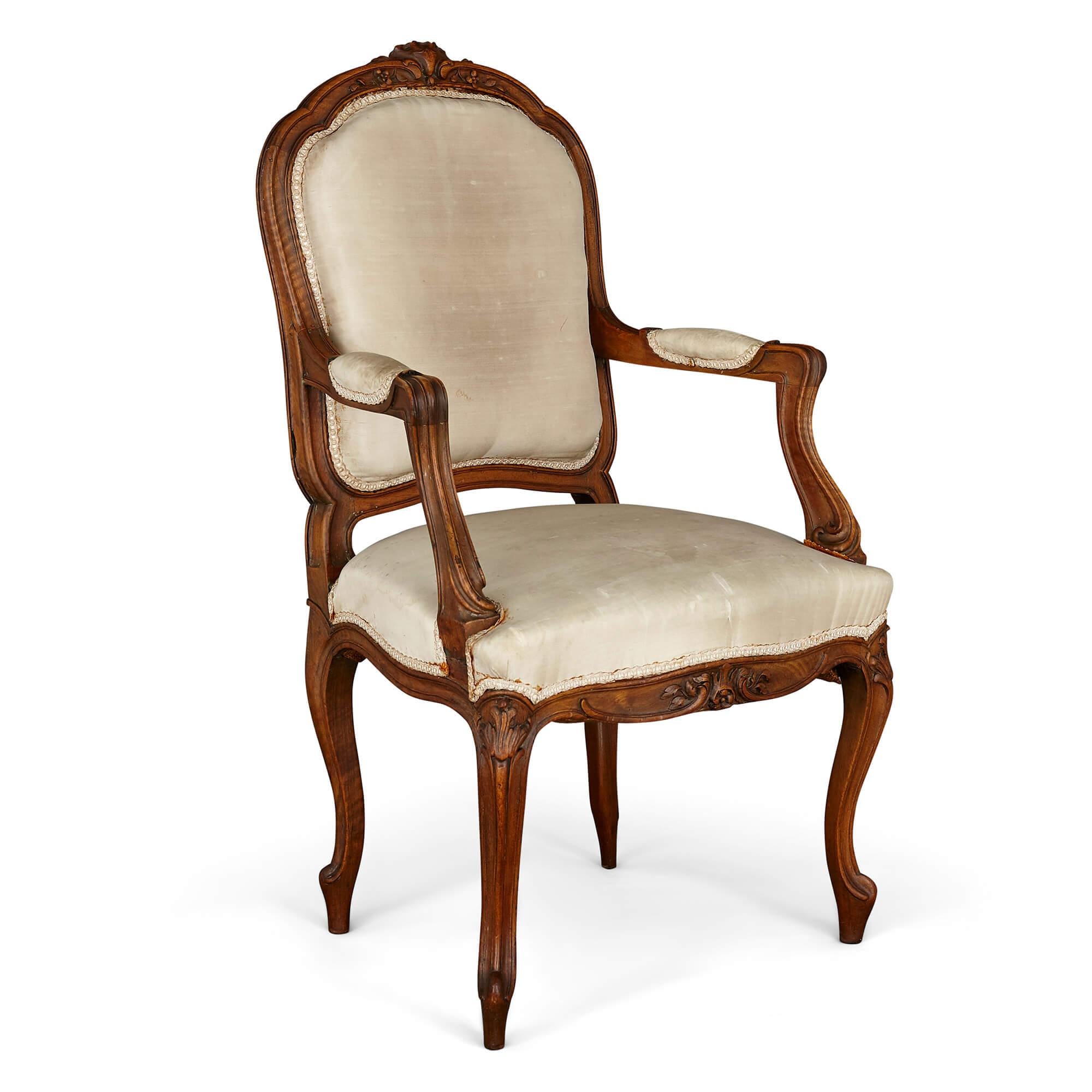 Set of Régence style mahogany armchairs and side chairs
French, early 20th century
Measures: Armchairs: Height 103cm, width 56cm, depth 50cm
Side chairs: Height 87cm, width 43cm, depth 40cm

The chairs in this set are crafted in the Régence