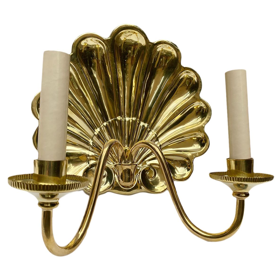 Set of four circa 1950's French repousse' and polished brass two-light sconces with shell motif backplate. Sold per pair.
Measurements:
Height: 10.5