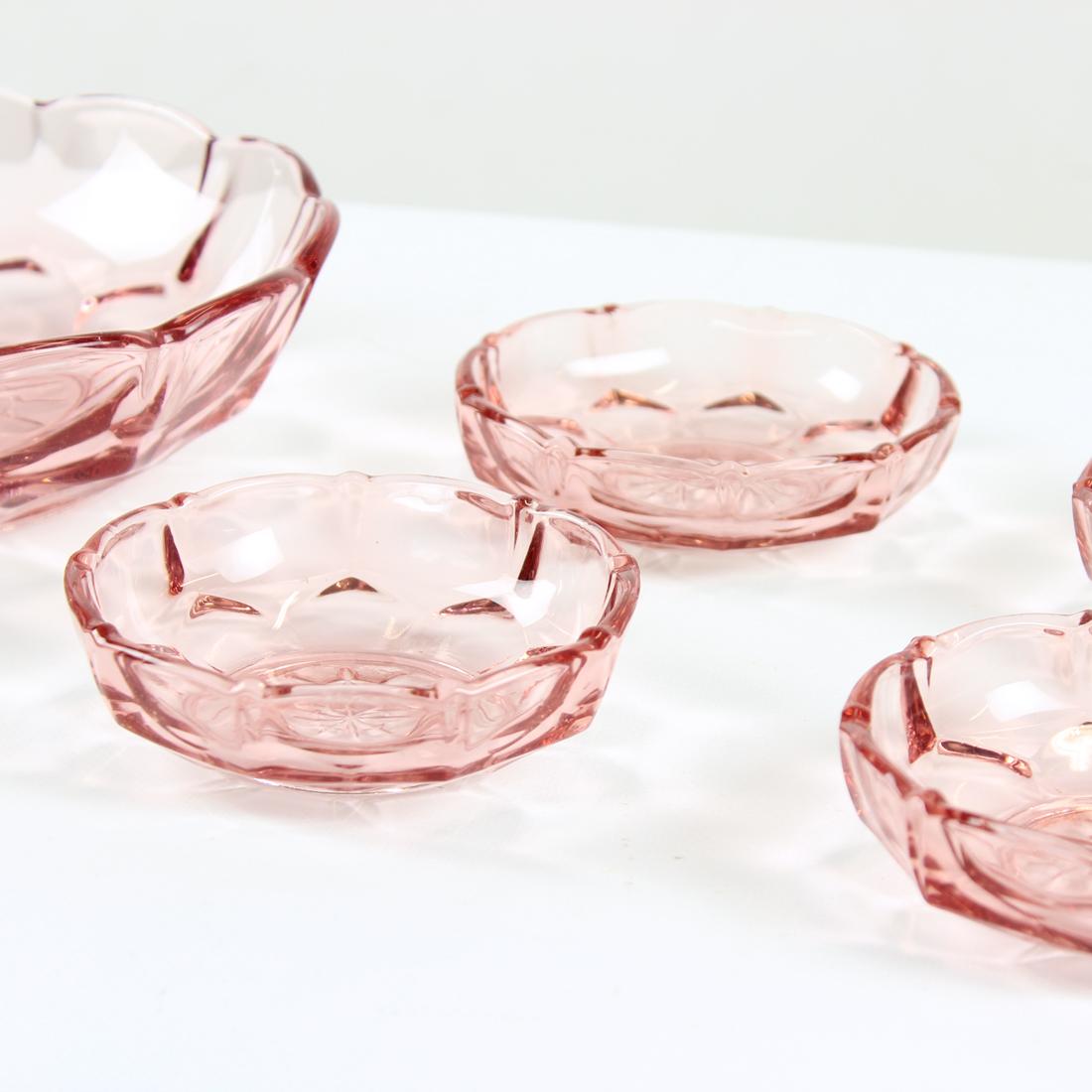 Beautiful set of five bowls produced in pressed glass in a lovely rose colored glass. The set can be used in the house, or in kitchen for daily use. Marked as Made in Czechoslovakia. The bowls were produced in 1950s. Beautiful set, ready to enhance