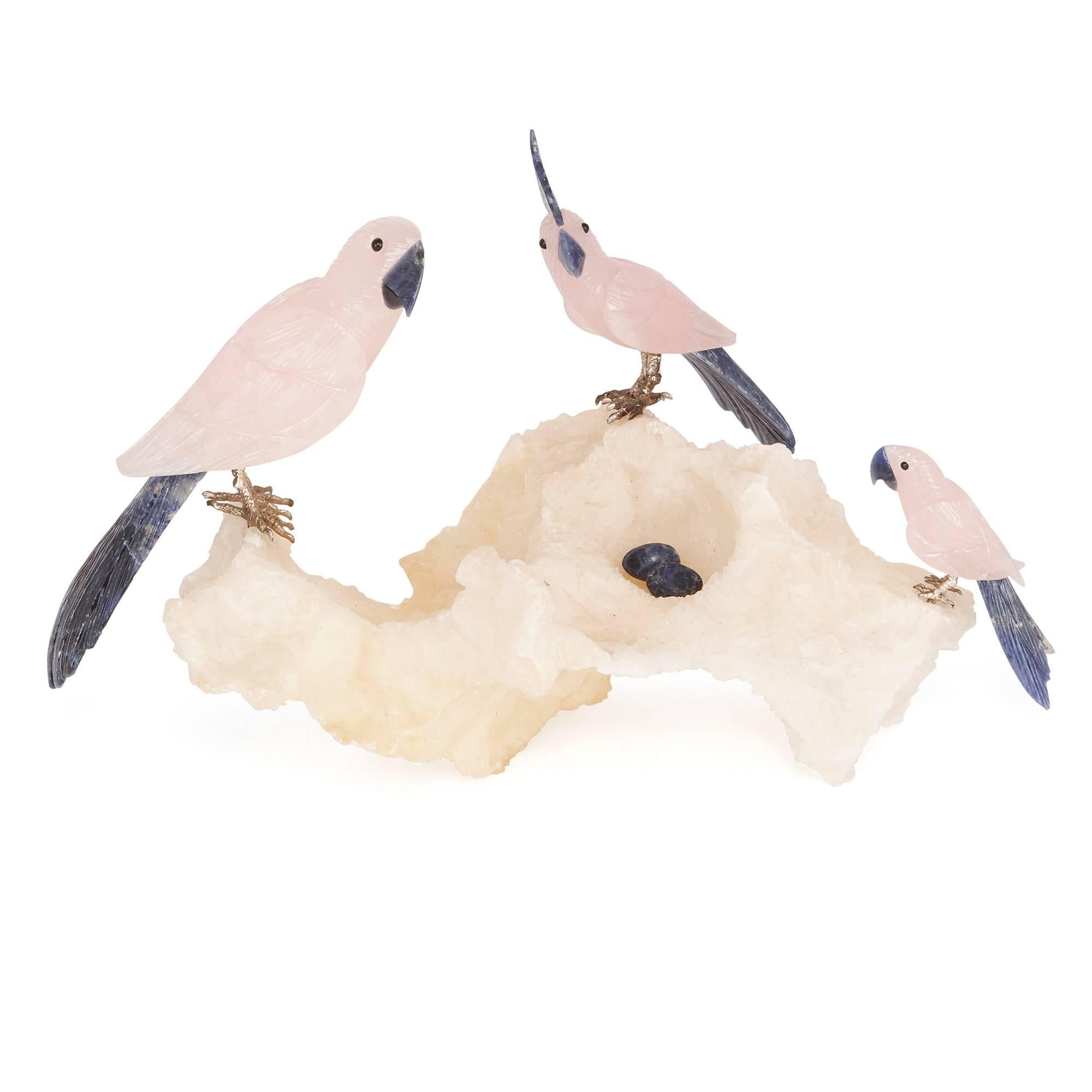 These delightful objets d'art are composed of the beautiful gemstones rosequartz and sodalite, and have been carefully sculpted to resemble five cockatoos perching on mineral specimen bases. The body of each cockatoo is sculpted from the pink