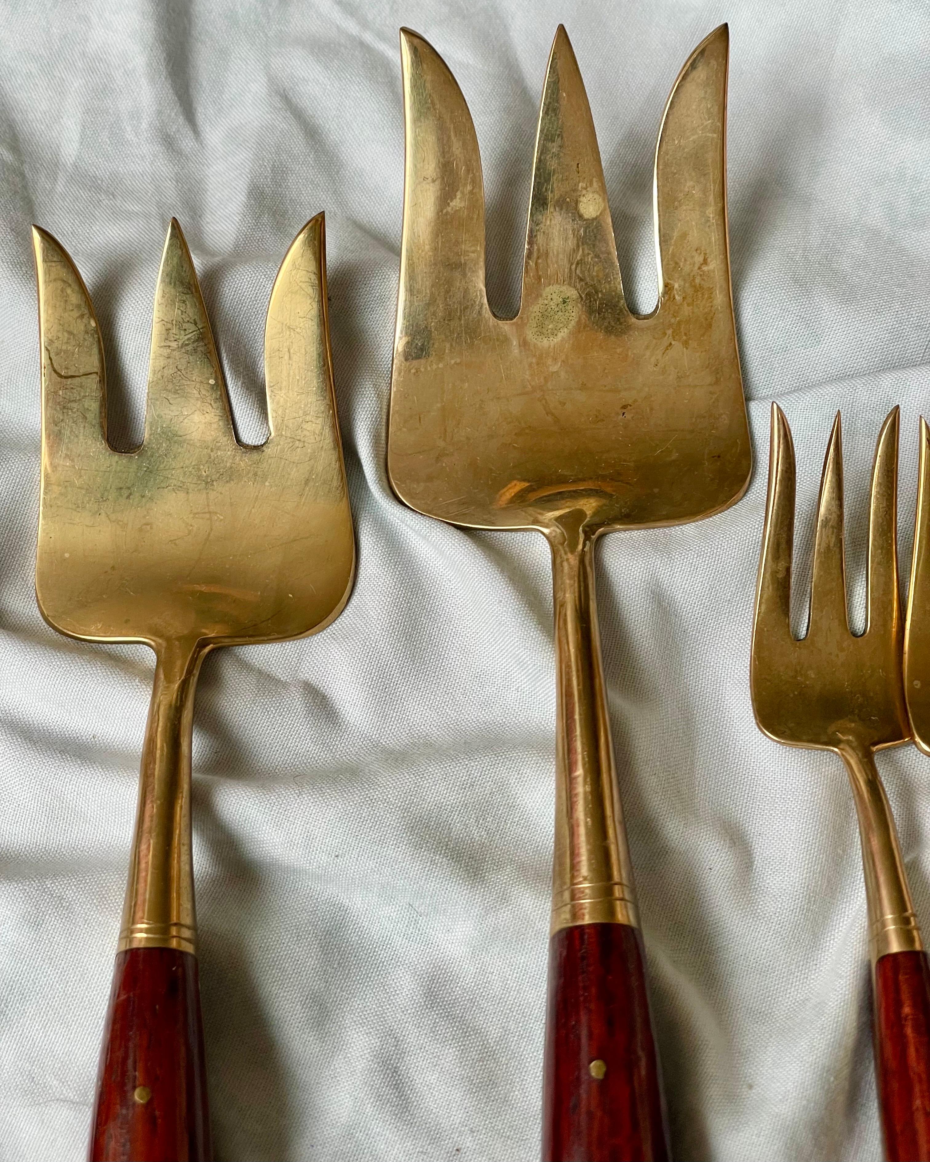 This is a beautiful set with 2 larger pieces and 6 individual forks. Great for holiday entertaining.

There are signs of oxidation and tarnish, this can be cleaned but you would loose the vintage patina. We have other pieces that match this