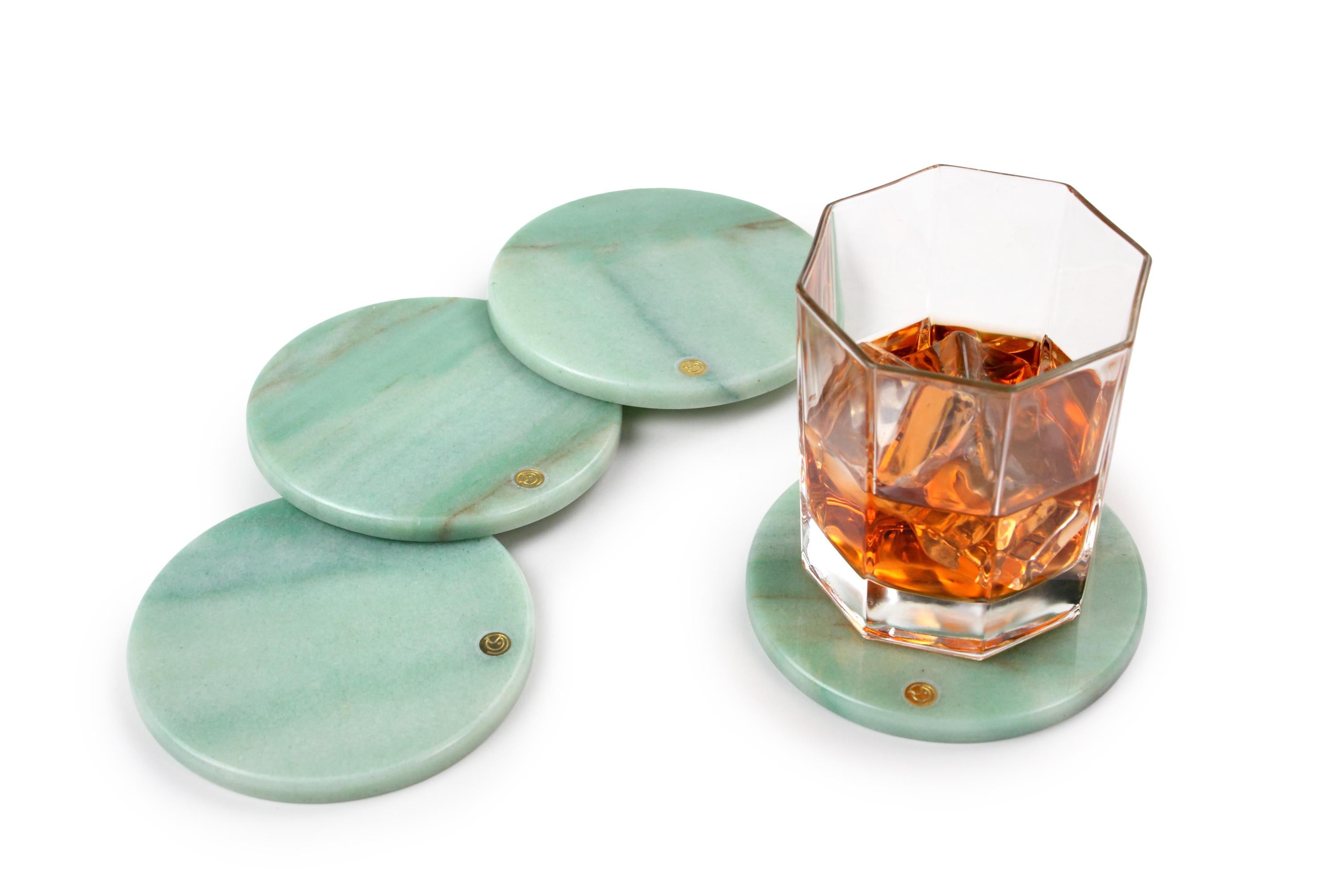 Set of 4 coasters in Green Quartzite.
Thanks to their shape and size they can be used as exclusive presentation plates for finger food.

Dimensions: D 10, H 0.8 cm
Also available: Square: L 10, W 10, H 0.8 cm
Available in different marbles, onyx and