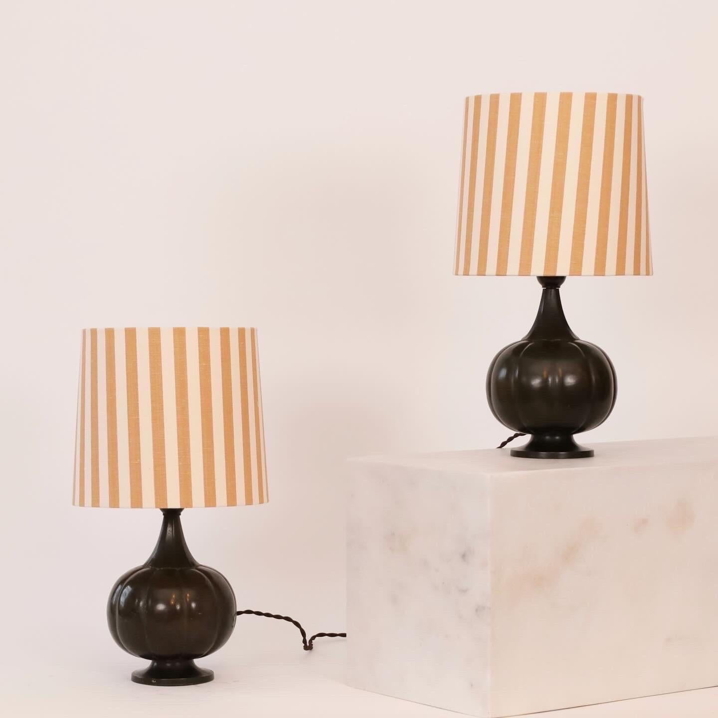 Set of 1920s pumpkin-shaped table lamps by Just Andersen accomplished with new shades in artisan textile from Mallorca. A rare set for a beautiful home.   
 
* Set of metal desk lamps with a pumpkin-shaped bases on foot and fabric shades with