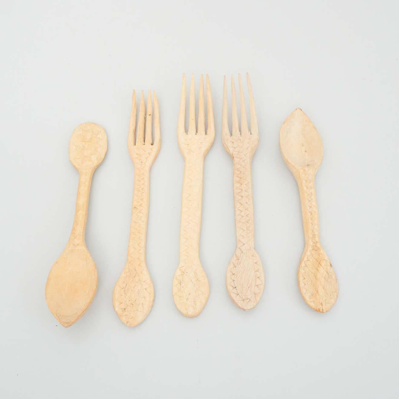 Set of rustic traditional hand carved forks and spoons, circa 1950
By Unknown Manufacturer, Spain.

In original condition with minor wear consisitent of age and use, preserving a beautiful patina.