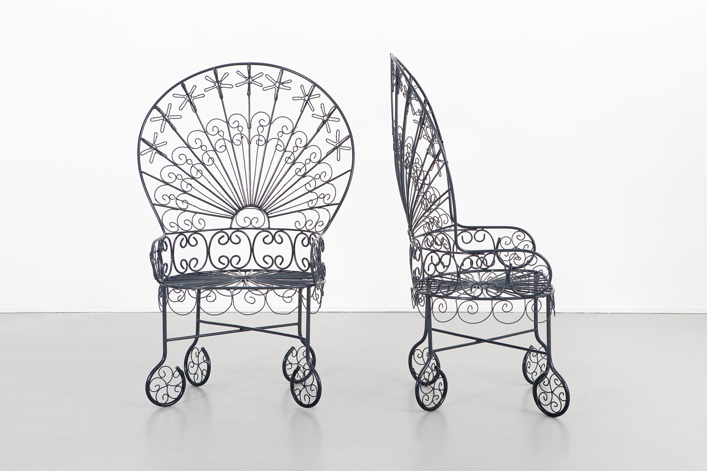 Set of two Peacock chairs.

Designed by John Salterini.

USA, circa 1930s.

Wrought iron.

Freshly powder coated. 

Measures: 43” H x 28 ¾” W x 21 ?” D x seat 16” H.

Color sample of powder coating available upon request.