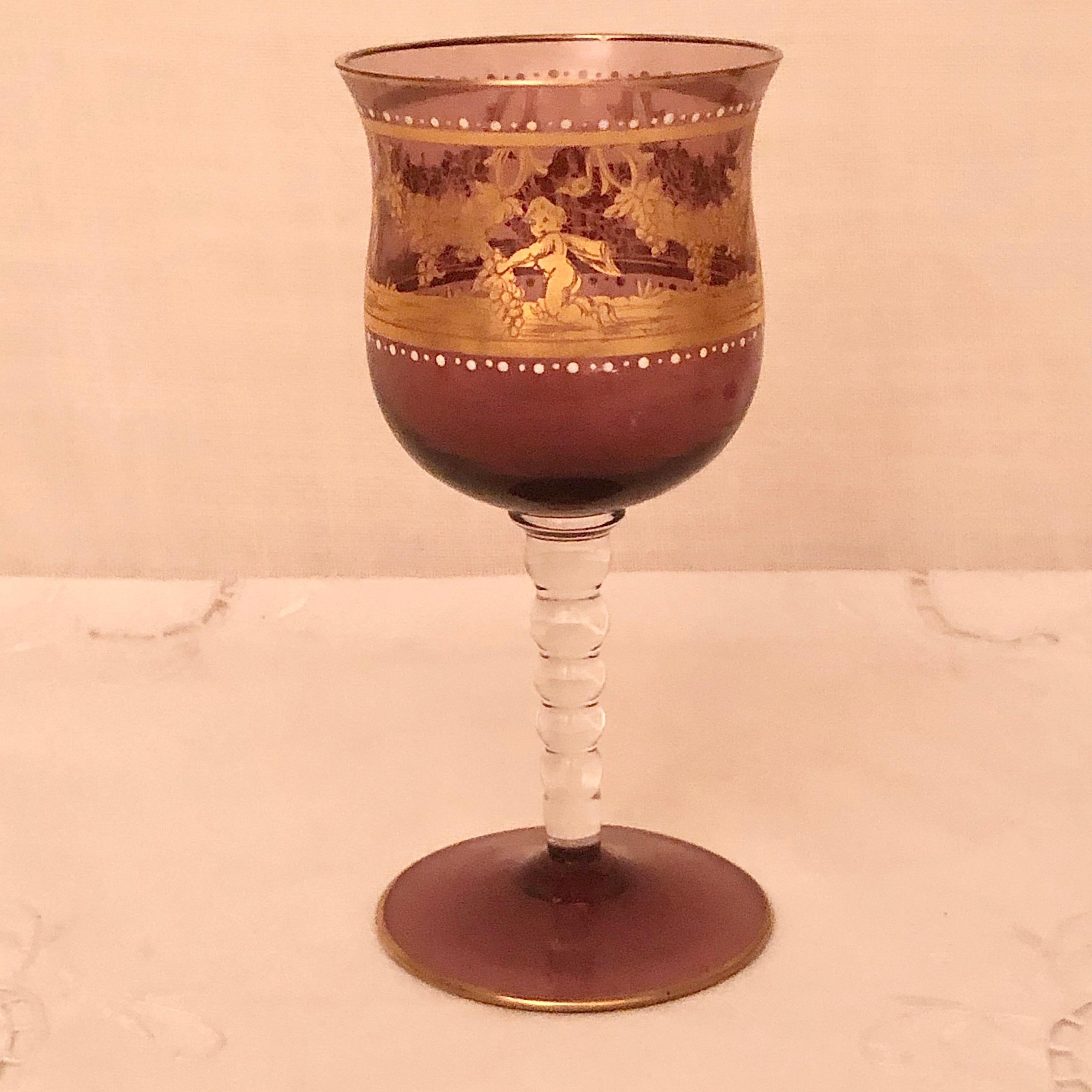 We are offering you this set of Salviati amethyst stemware decorated with gold cherubs picking grapes off of grape garlands with white enamel jeweling. This set would be a stunning way to serve your vintage wine or champagne. It would be an