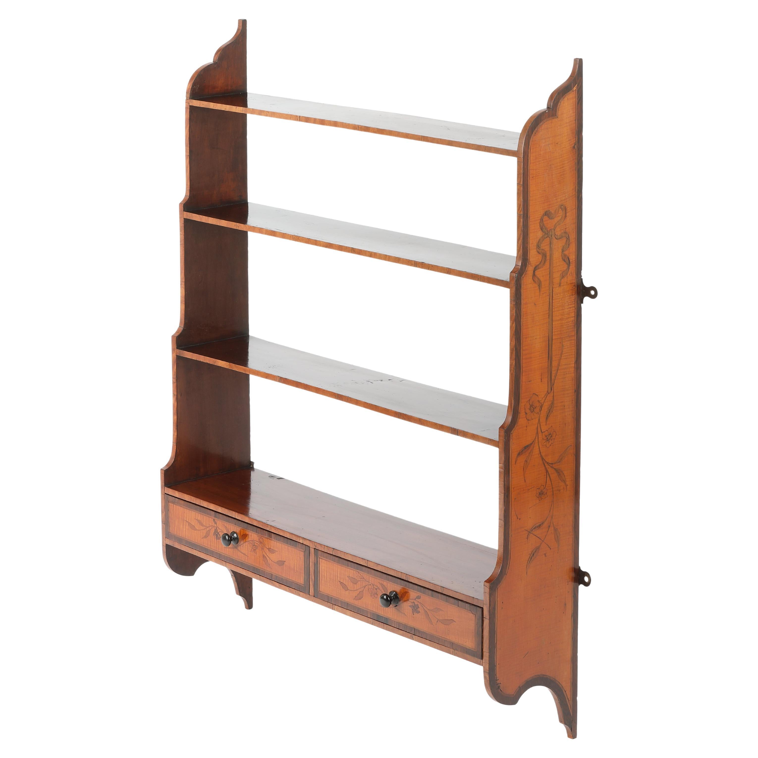 Set of satinwood and mahogany hanging waterfall bookshelves For Sale