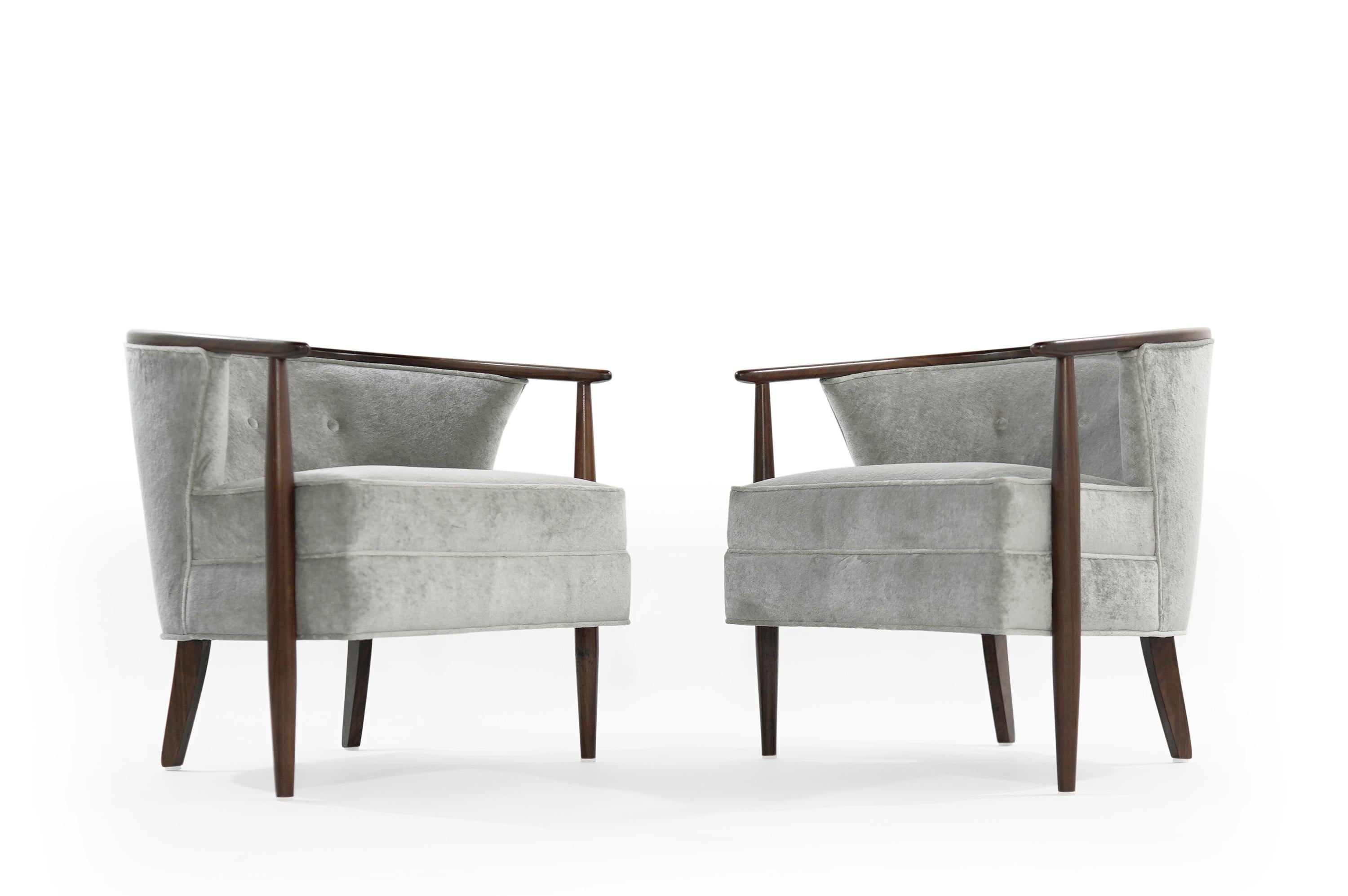 Pair of Scandinavian lounge chairs, newly upholstered in distressed grey linen by Holly Hunt. Exposed walnut frame work fully restored.