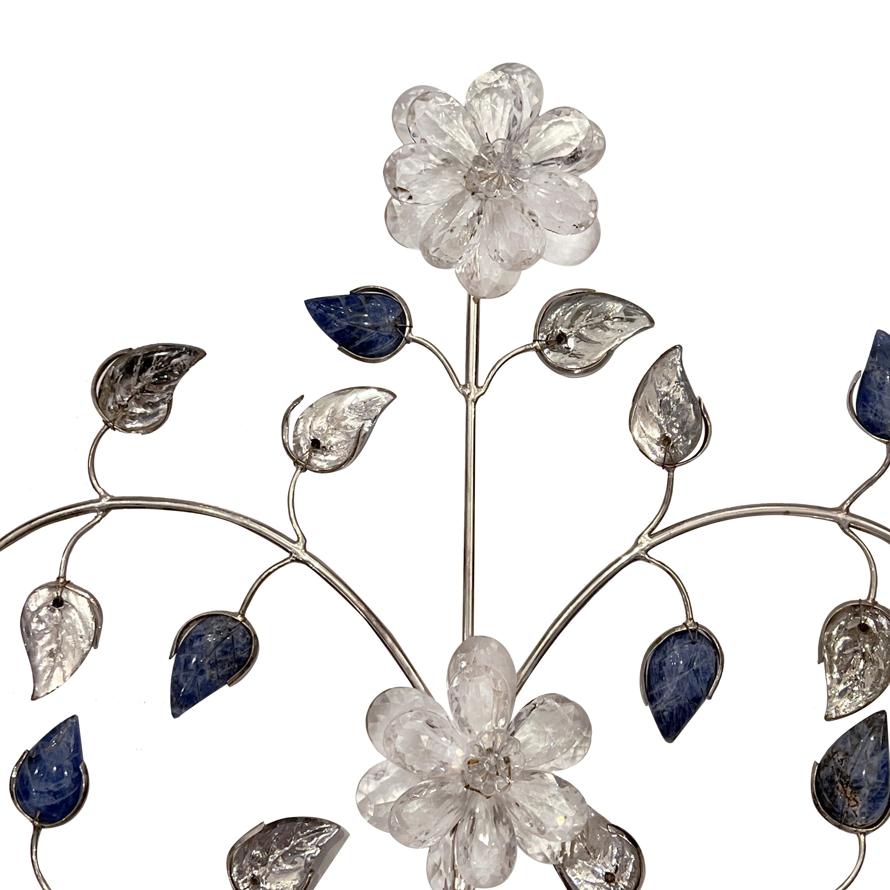 A set of 4 circa 1950's silver plated sconces with crystal leaves and flowers with lapis lazuli body.

Measurements:
Height: 26