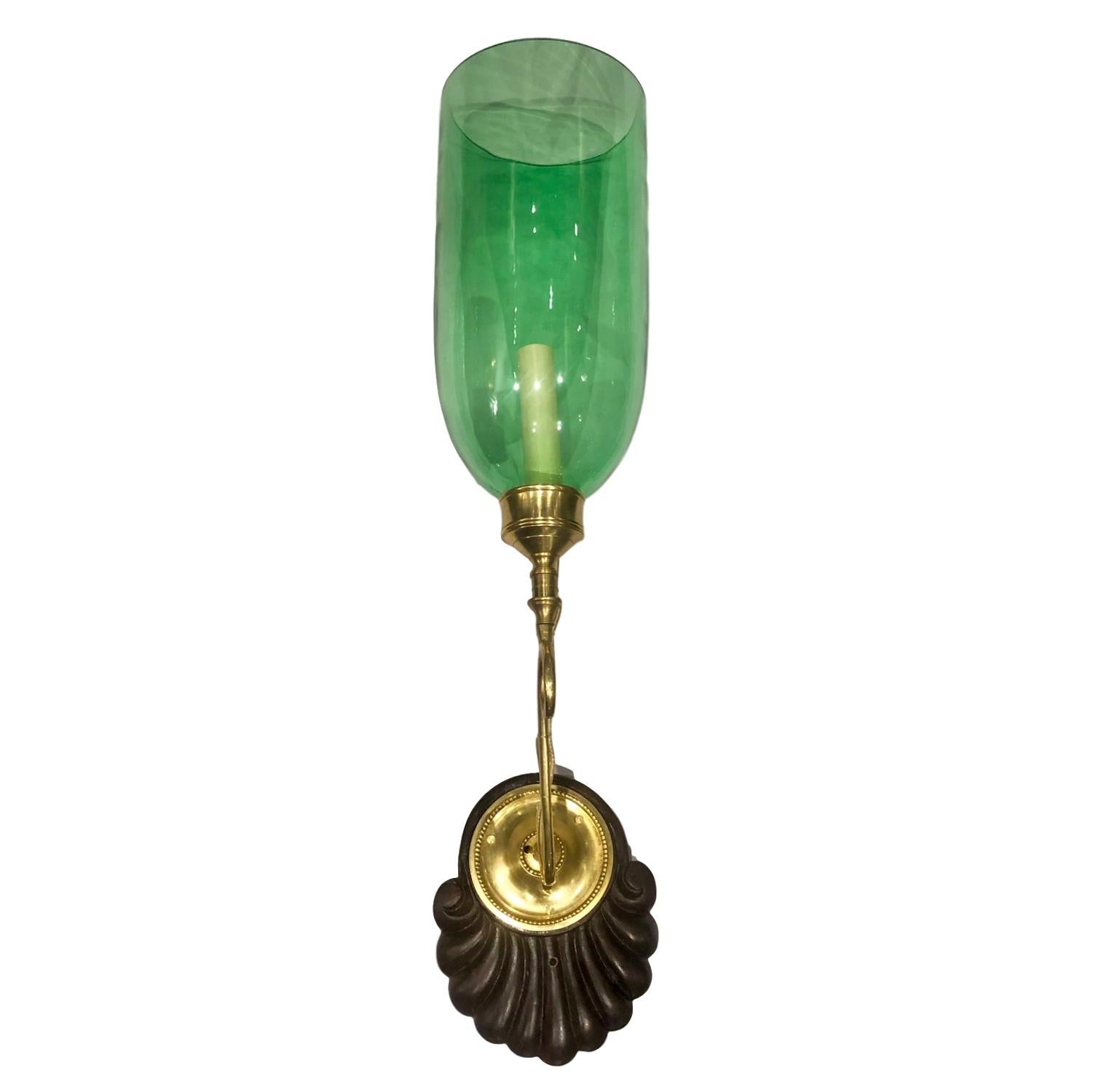 A set of four circa 1920s Anglo-Indian single light sconces with hand carved wood backplate and emerald green blown glass hurricanes. Sold per pair.

Measurements:
Height 24?
Depth 12?
Width 5.5?