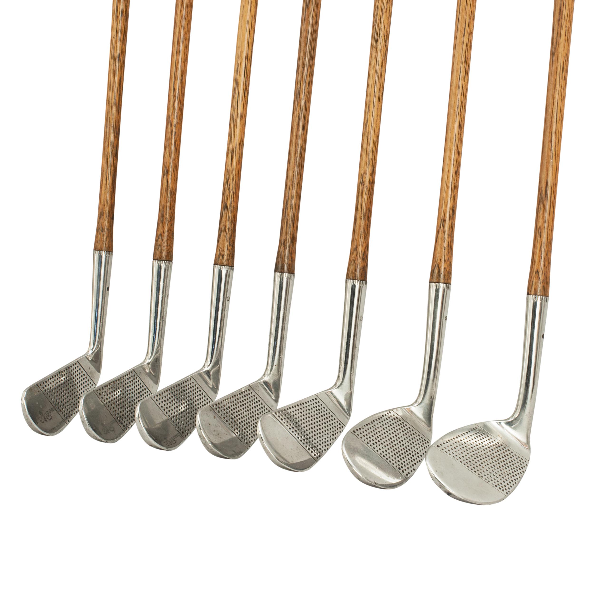 Set of seven playable Hickory golf clubs.
A very good set of seven hickory shafted irons by Nicoll of Leven. The set includes No.1, 2, 3, 4 iron, No.5 mashie, No.7 mashie-niblick & No.8 niblick. The club heads are all stamped with Nicoll's 'hand'