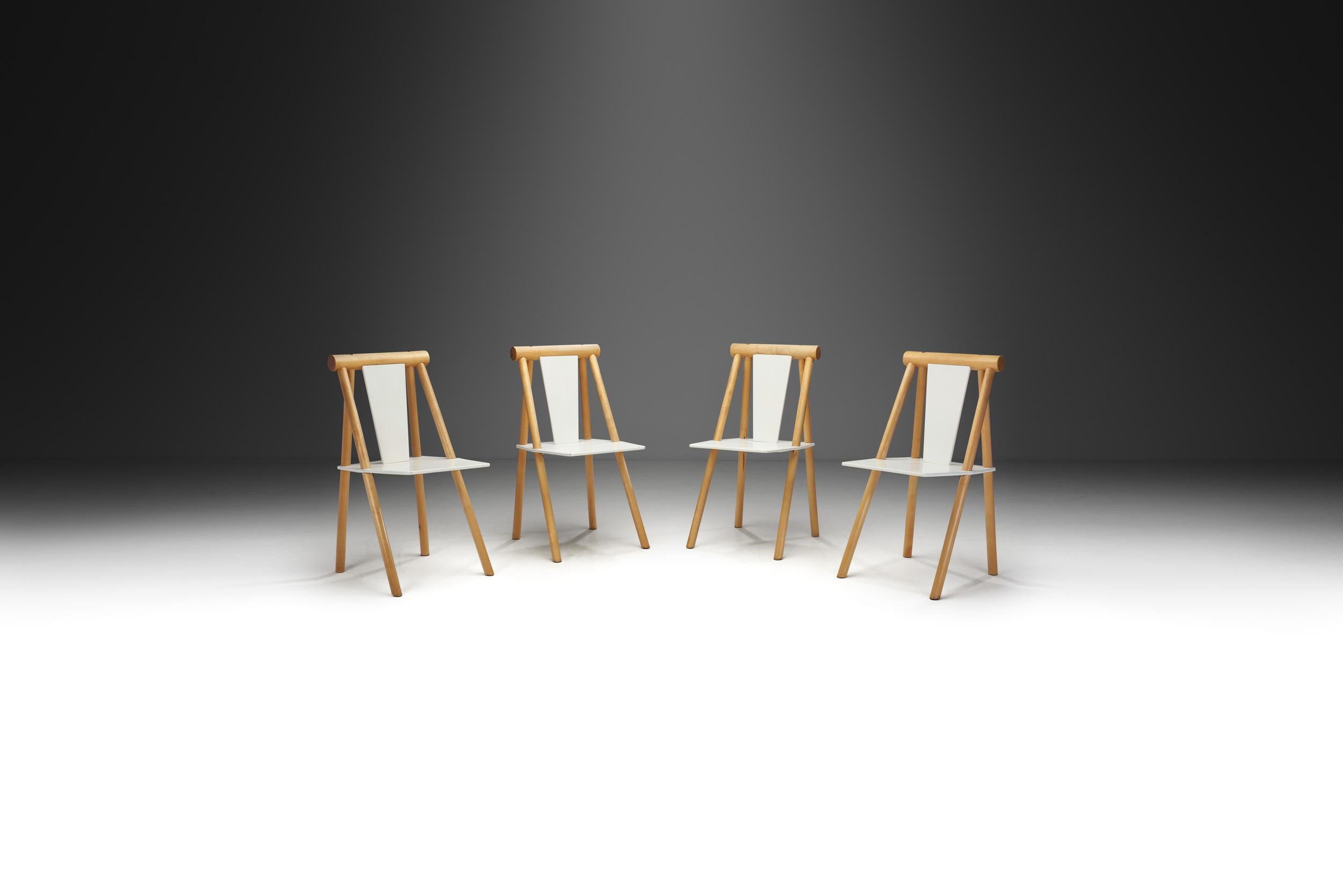 The artistic flair is apparent with this set of four dining chairs. The design uses elements of geometry to create a unique look based on the natural qualities of wood.

These chairs have an interesting look as a result of the structure that