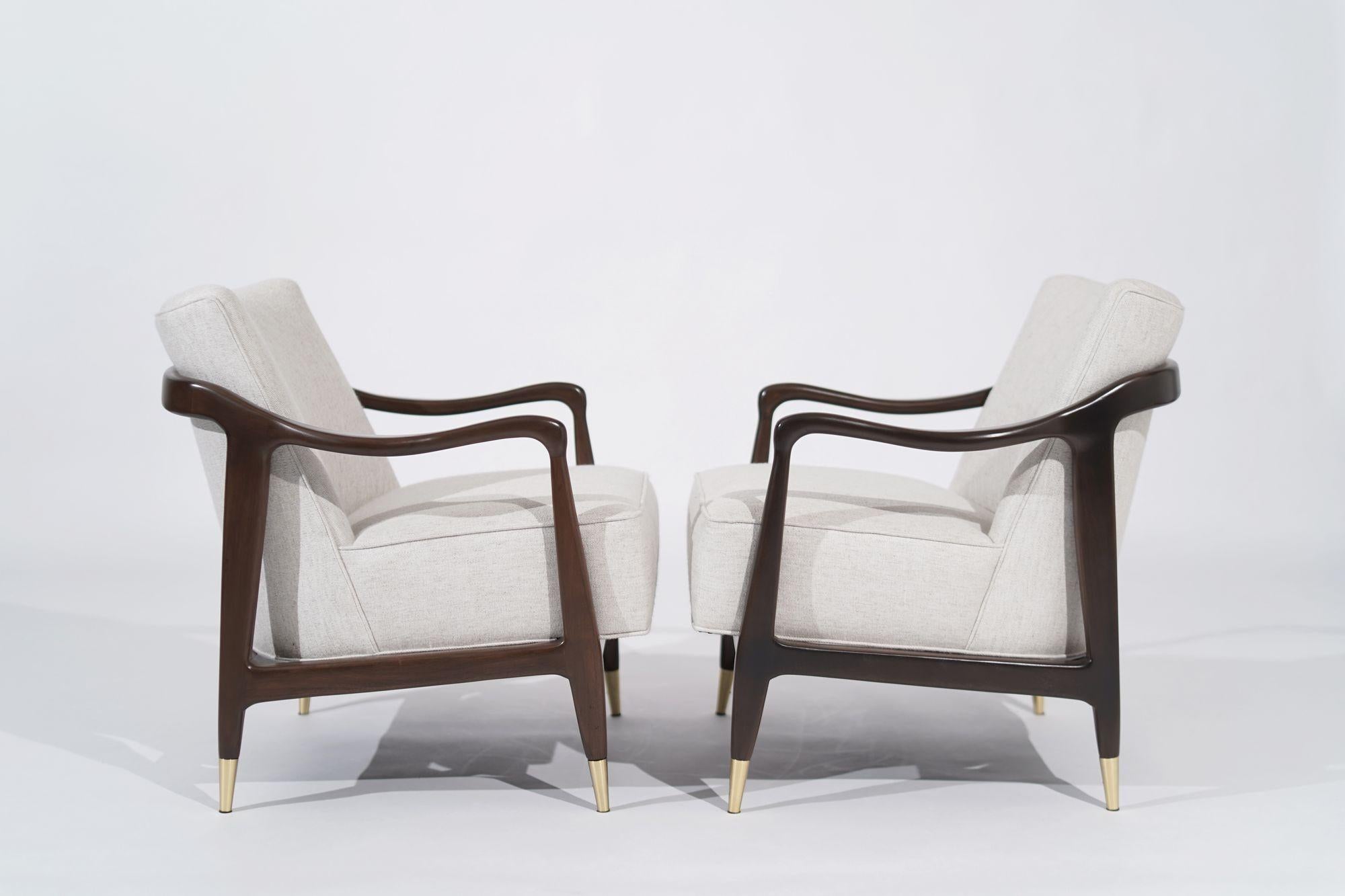 Elevate your space this vintage set of chairs in Gio Ponti's iconic 1950s style, exuding timeless elegance and mid-century modern flair. Meticulously crafted with sleek lines and brass sabots for durability, these chairs blend vintage charm with