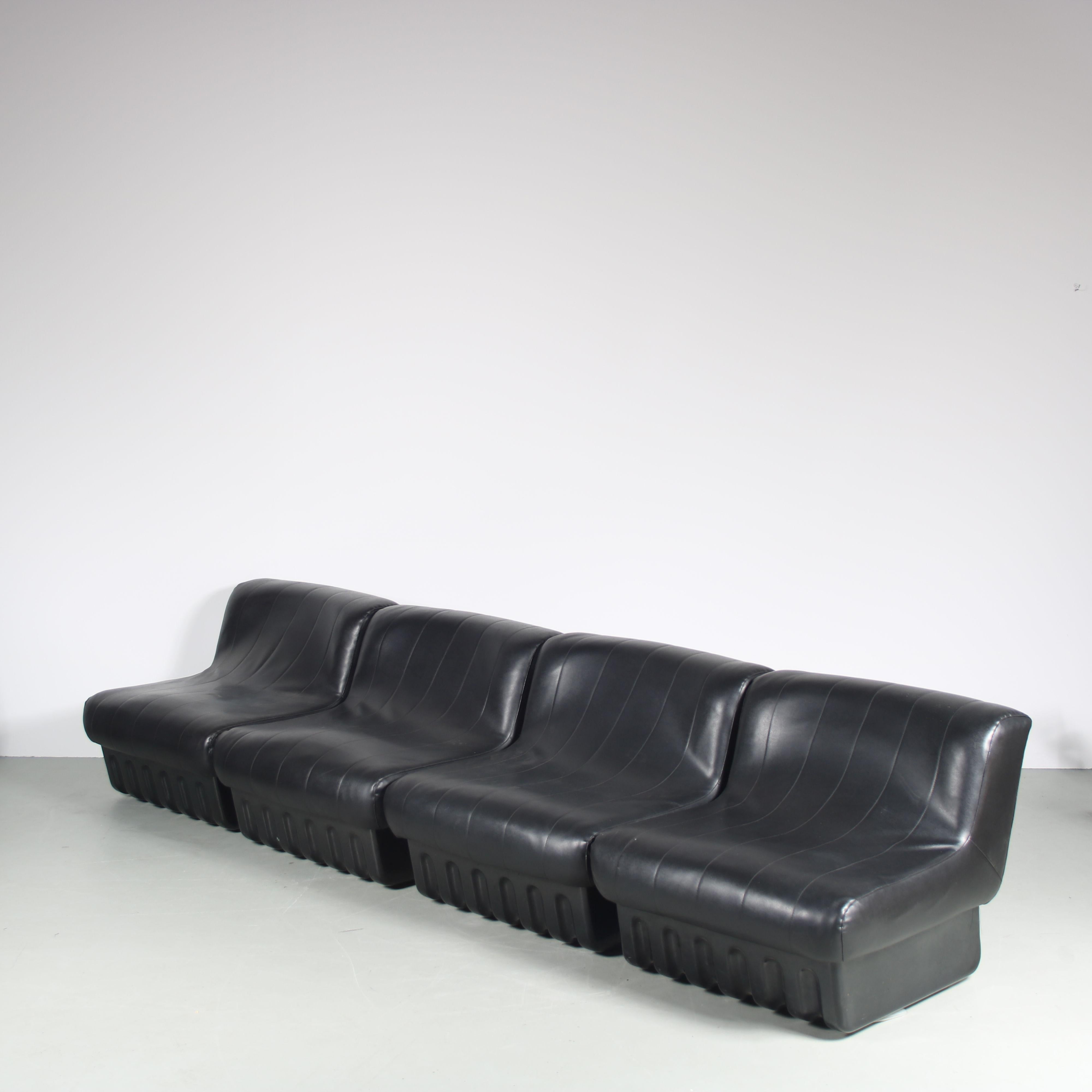 An eye-catching set of four rare seating / sofa elements designed by Masonari Umeda and manufactured by Formapin, Italy around 1960.

Each element has a black plastic base with unique shape, holding a thick seat that is upholstered in black skai
