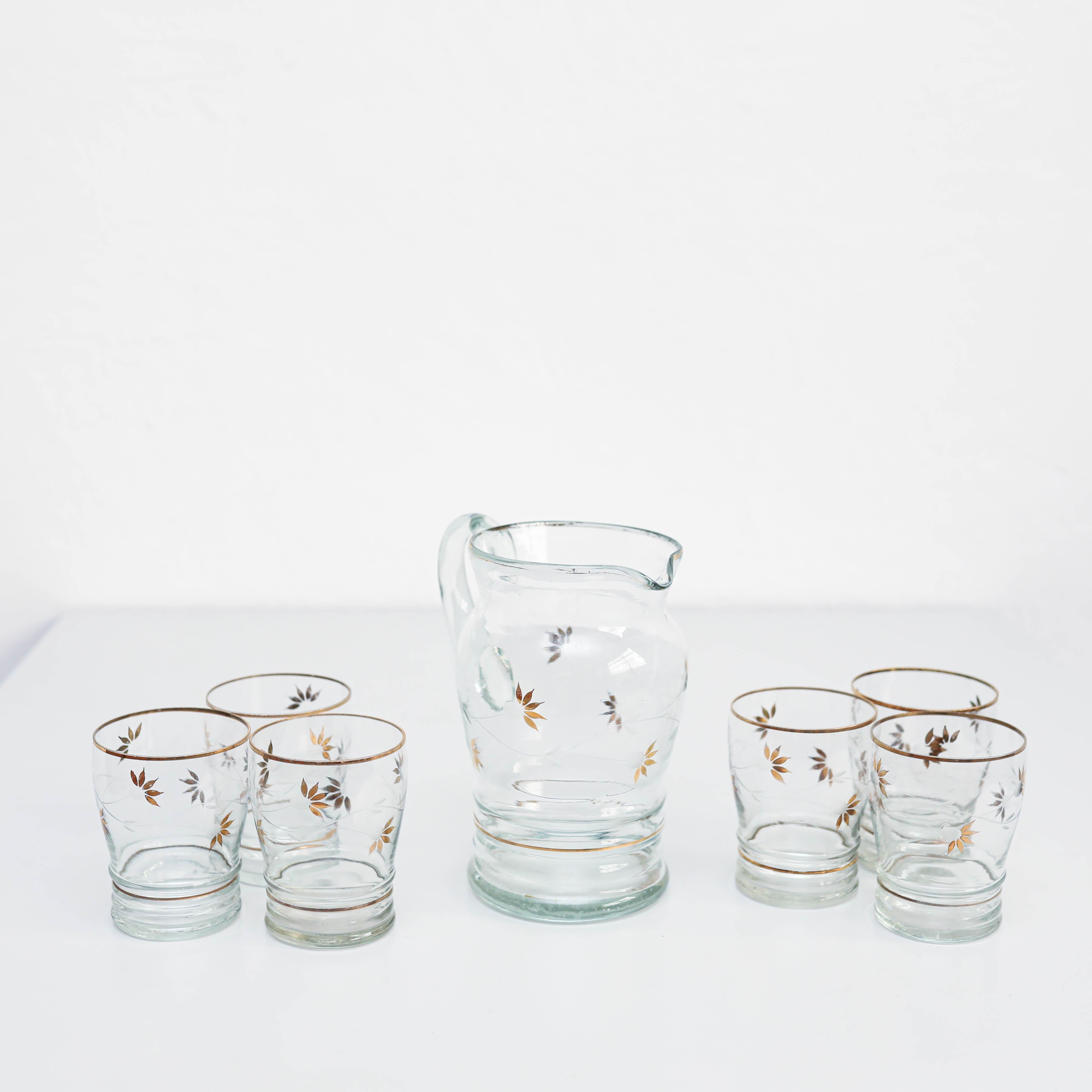  Set of seven Vintage Glass Vase and glasses.

Made by unknown manufacturer in Spain, circa 1980.

In original condition, with minor wear consistent with age and use, preserving a beautiful patina.

Materials:
Glass

Dimensions:
Vase: H 19 cm x W