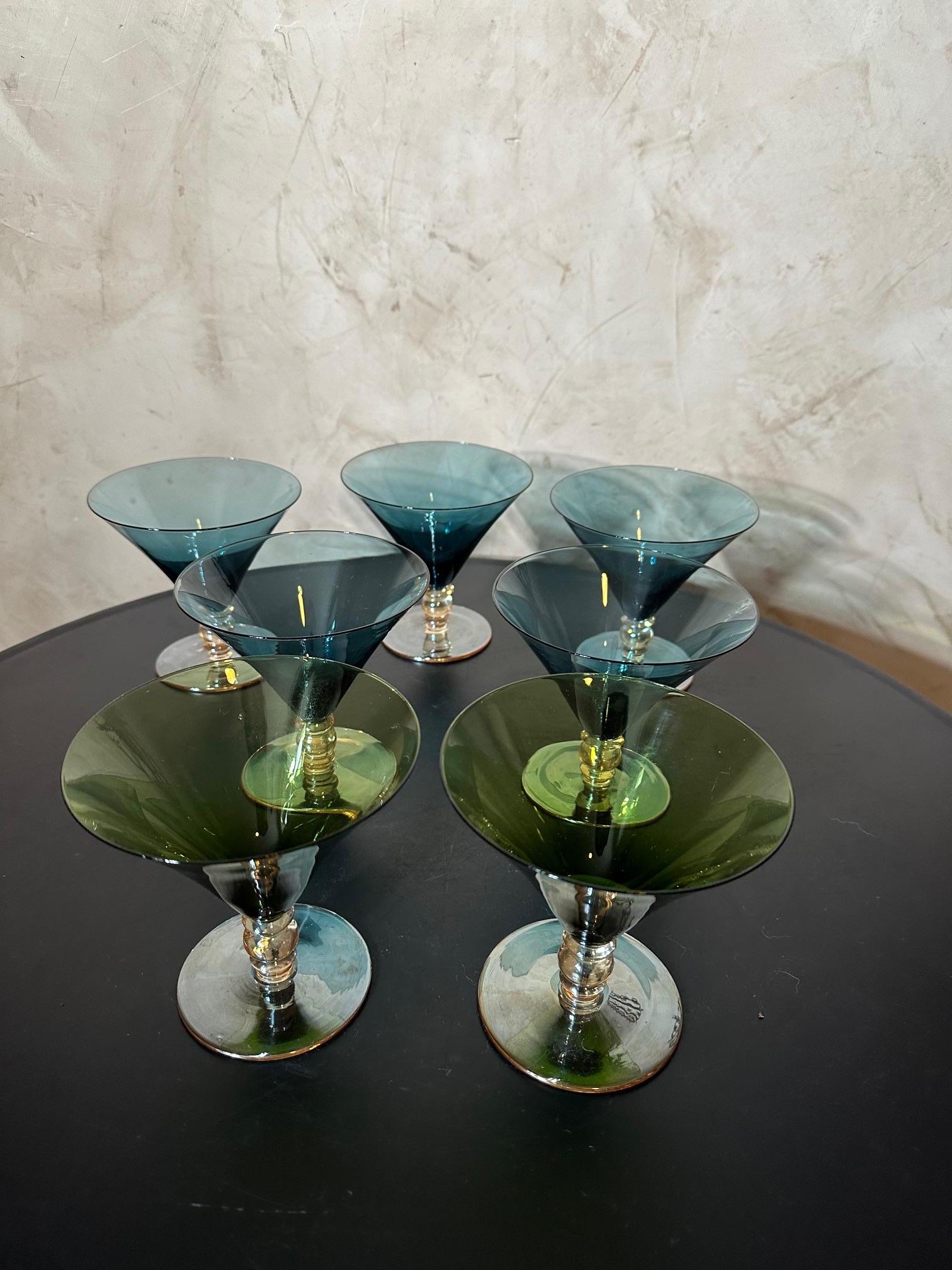 Set of seven colorful cocktail glasses from the 70s. 
Five blue and two green glasses.
Very good quality and good condition.