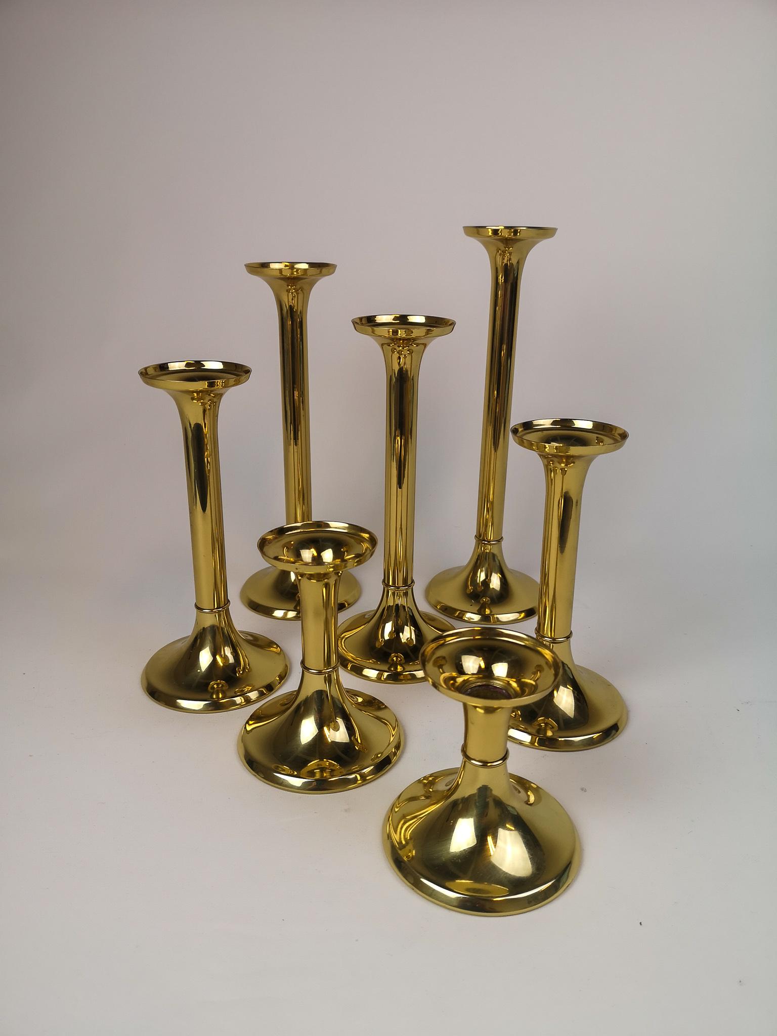 A set of seven candleholders in Brass. Manufactured at G.V Harnisch in Copenhagen. Made for their lanterns and candleholder for the marine environment, these candleholders are more suited for the modern home. 

Good condition. 

Measures from H