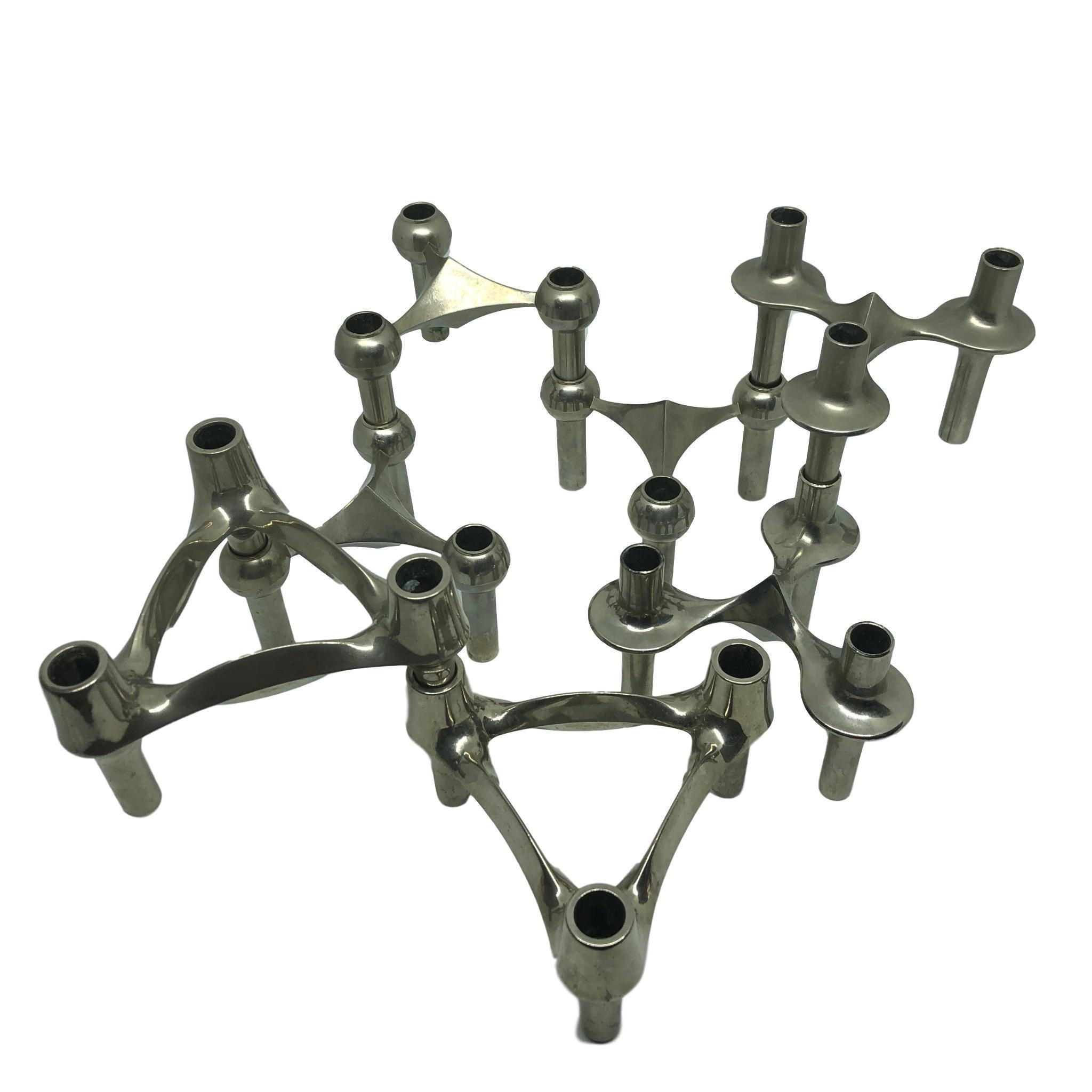 Unusual set of seven midcentury modular triangle shaped chrome candle holders by BMF. Made in Germany in the 1970s. The candleholders can be stacked in whichever design you wish with as many candles you would like. 3 different designs like seen in