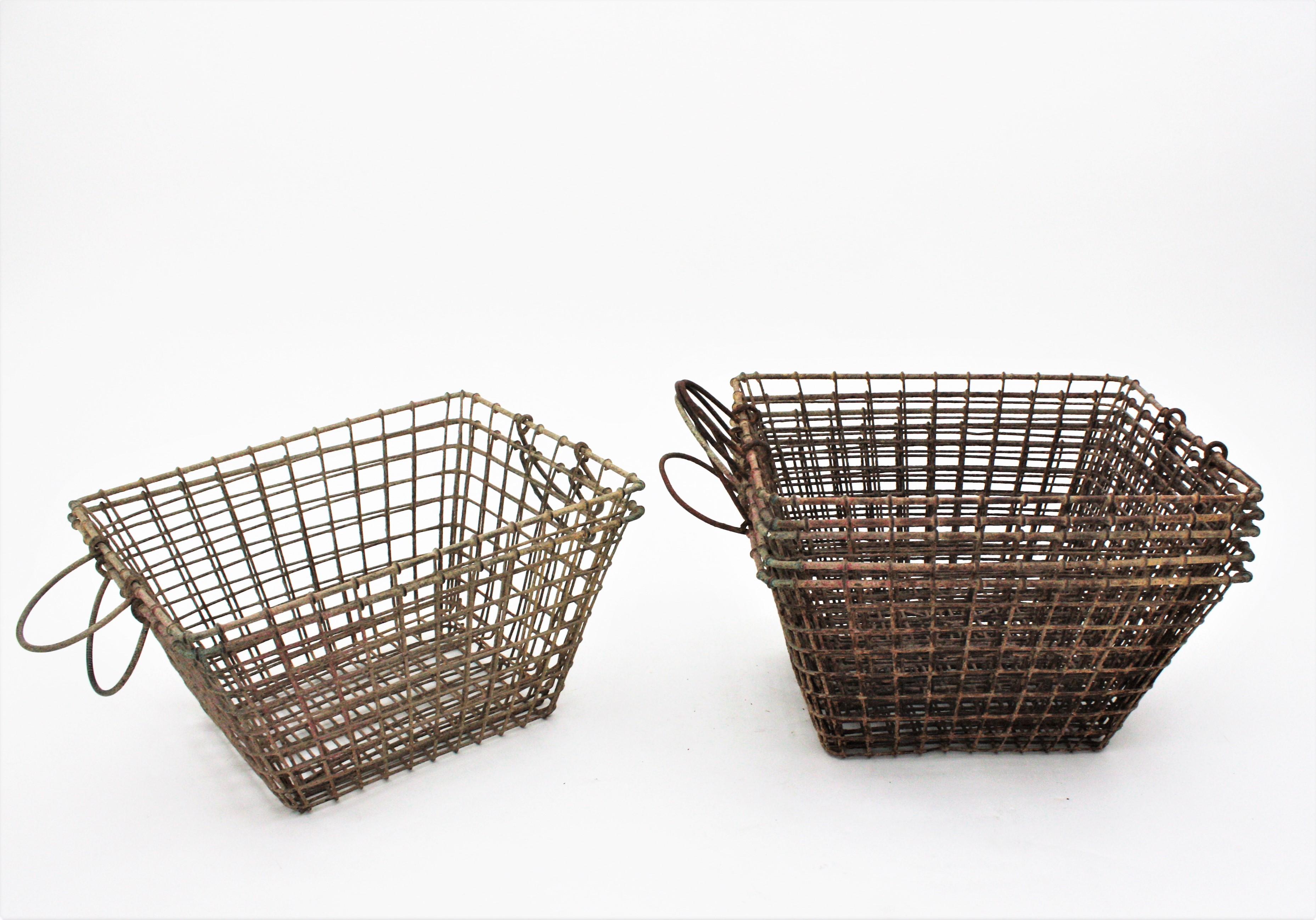 Set of Seven Vintage Metal Wire Coquillage baskets, France, 1960s.
Traditional metal baskets used by french oyster farmers at low tide for harvest. 
Very good vintage condition and terrific aged patina.
Interesting for Storage or decorative