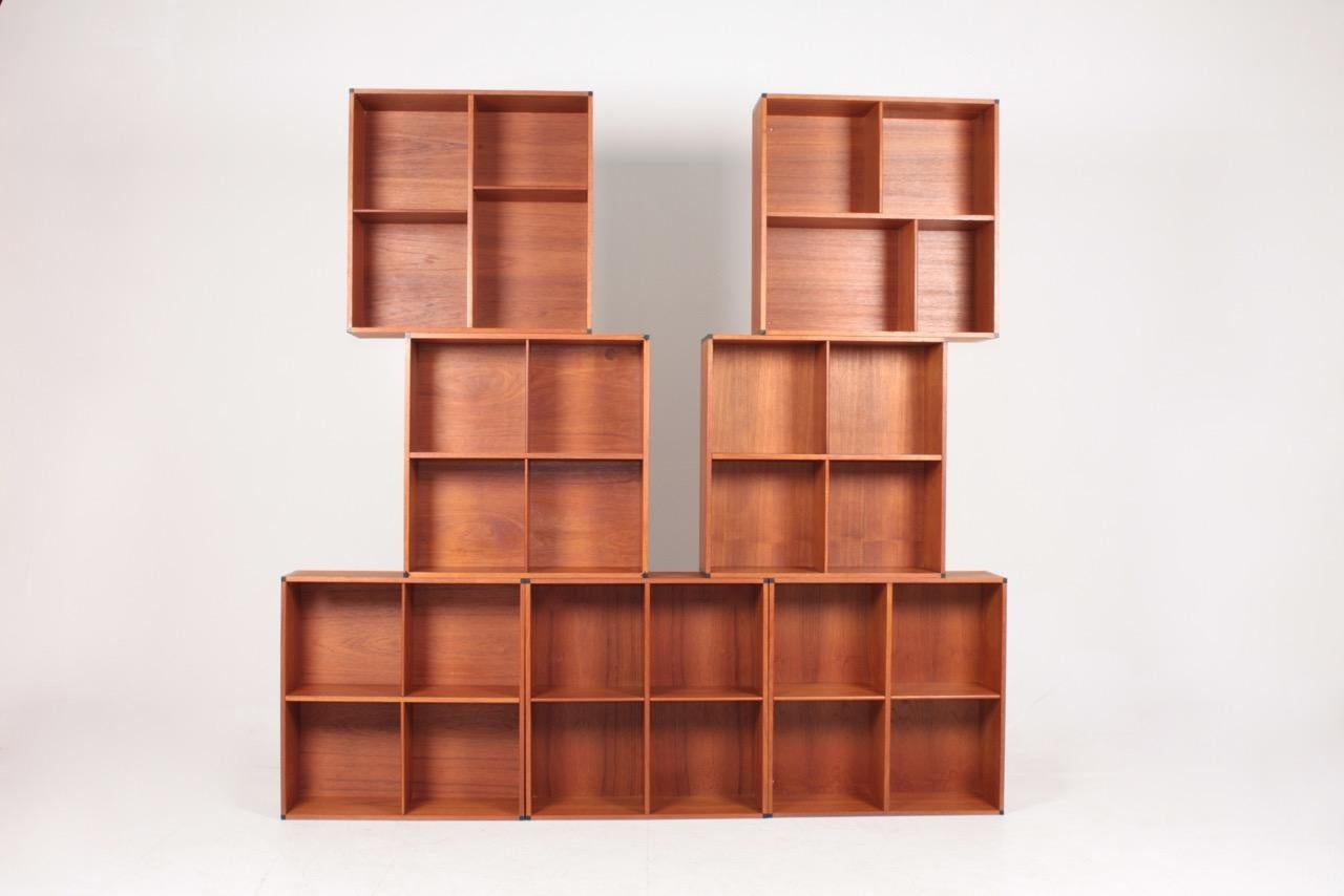 Set of ten matching wall-mounted bookcases in walnut. Designed and made in Denmark. Great original condition.