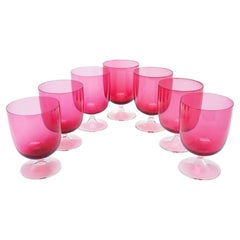 Set of seven English hand blown cranberry goblets, c. 1900