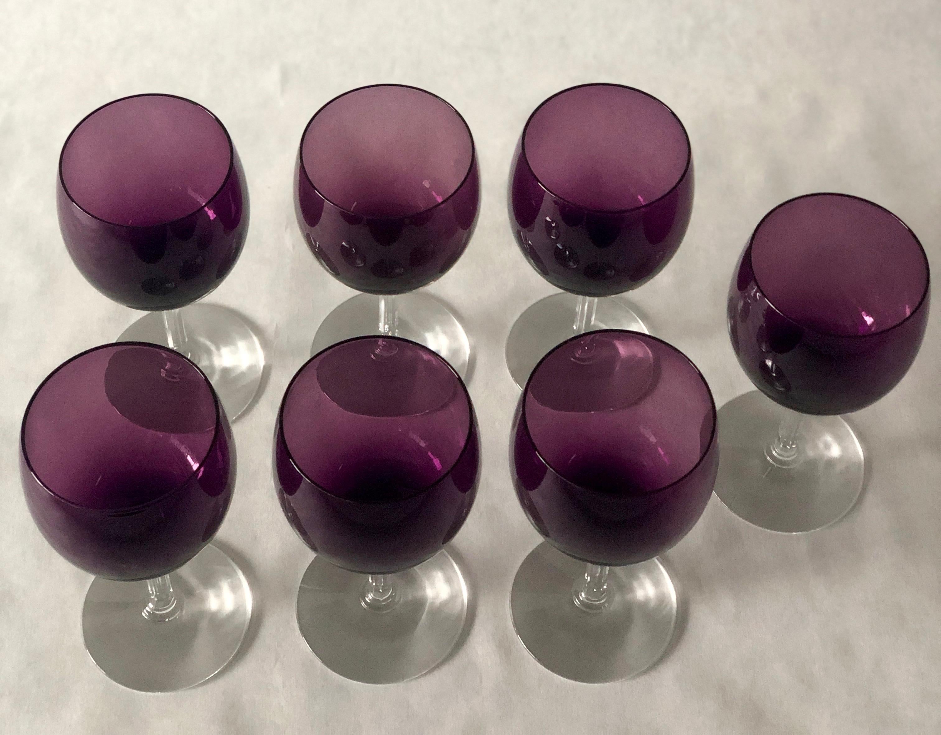 Offered is a set of seven crystal wine or water goblets / glasses in a beautiful deep purple shade and clear stem by Fostoria. This set of barware/ crystal goblets in deep purple and clear gleaming crystal would be perfect for holiday entertaining