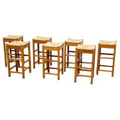 set of seven French rattan and wood barstools