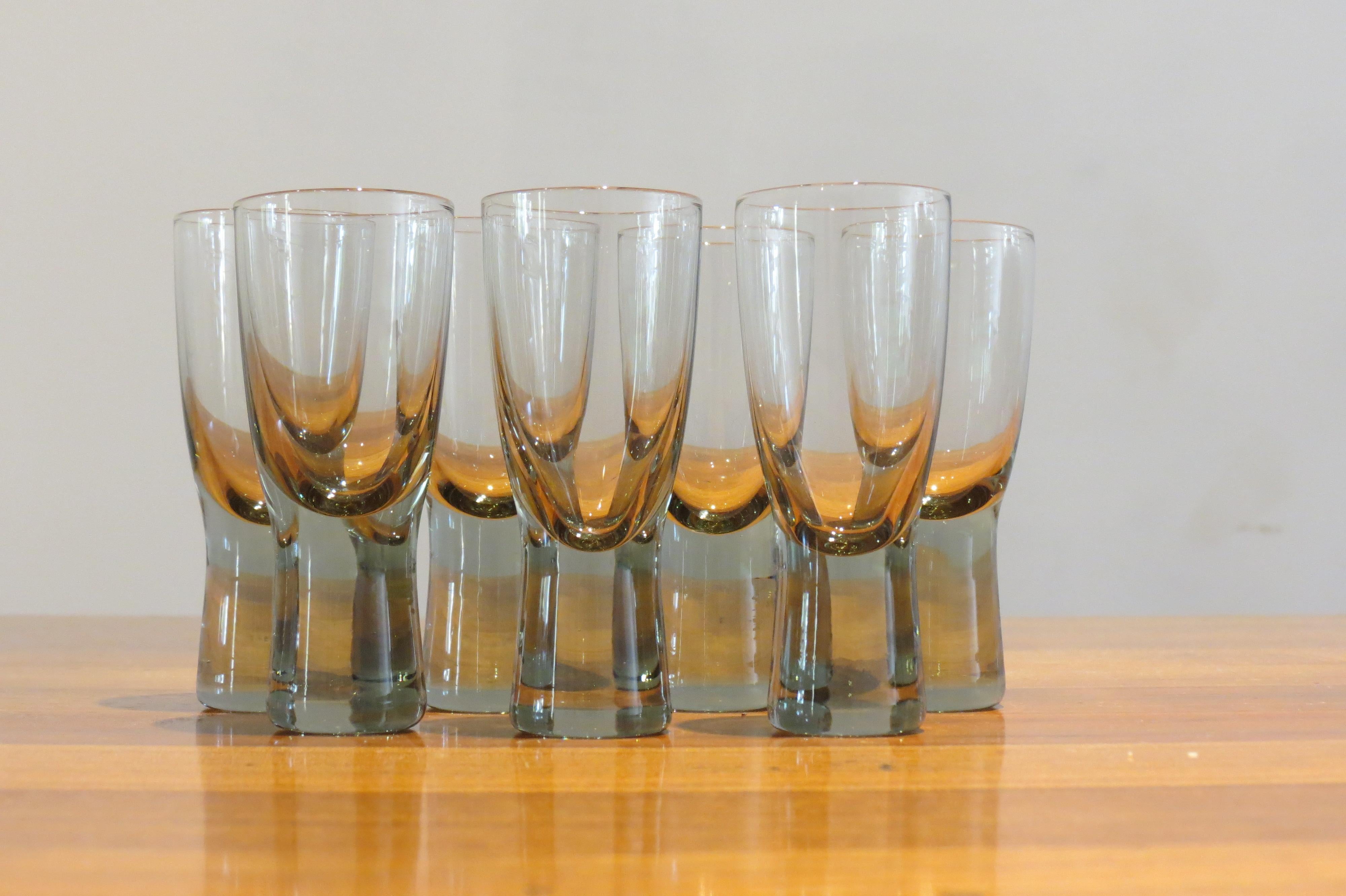 Holmegaard Canada glasses by Per Lutken
A set of seven vintage Holmegaard glasses.
Designed by Per Lutken, model Canada, 1950s.
Smoked glass
Good condition
Measures: 8 cm tall, 3.2cm diameter widest point
St927.

          