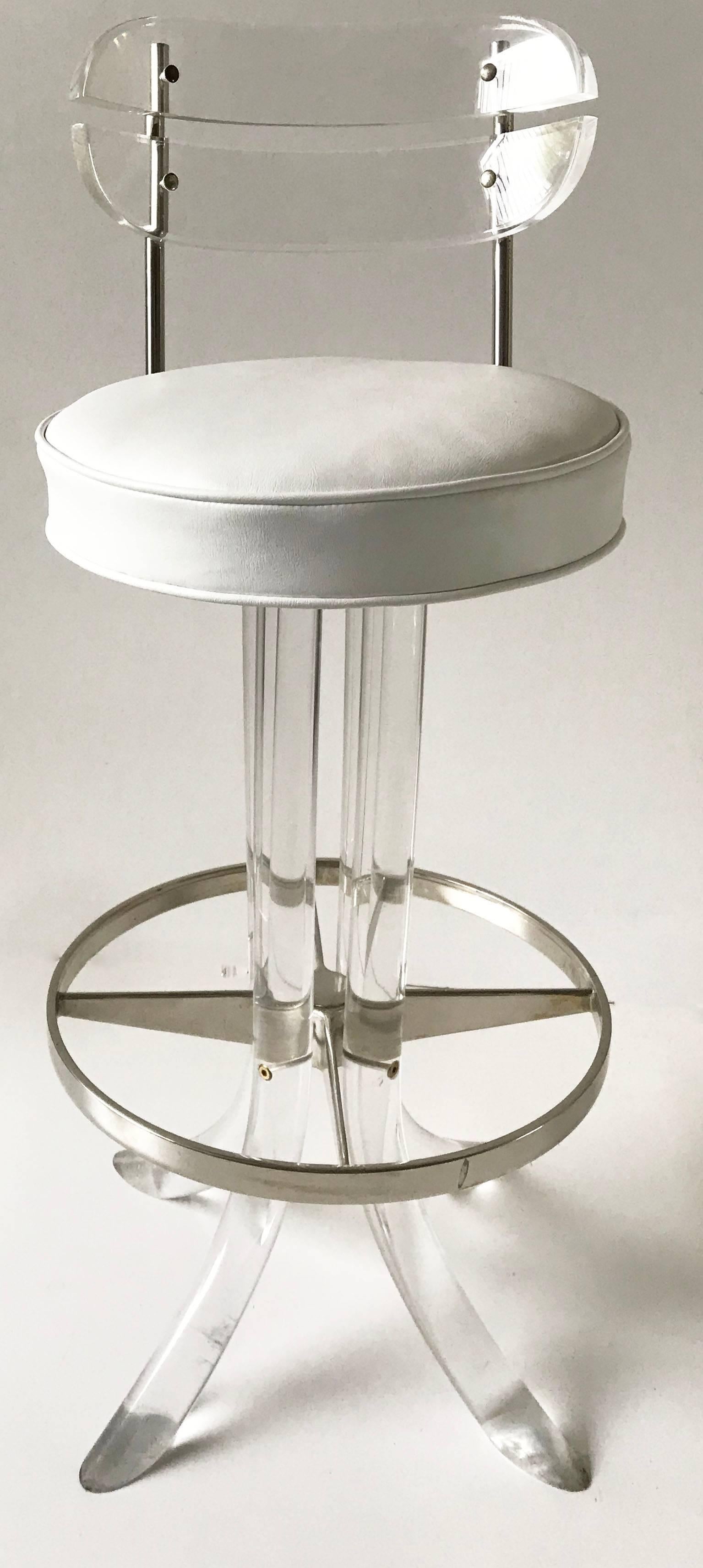 Set of Seven Hill manufacturing barstools Lucite and chrome with white vinyl seat top
Measures: High seat: 28.5