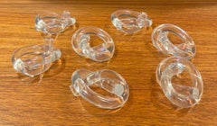 Set of Seven MCM "Pretzel" Shaped Lucite Napkin Rings by Dorothy Thorpe