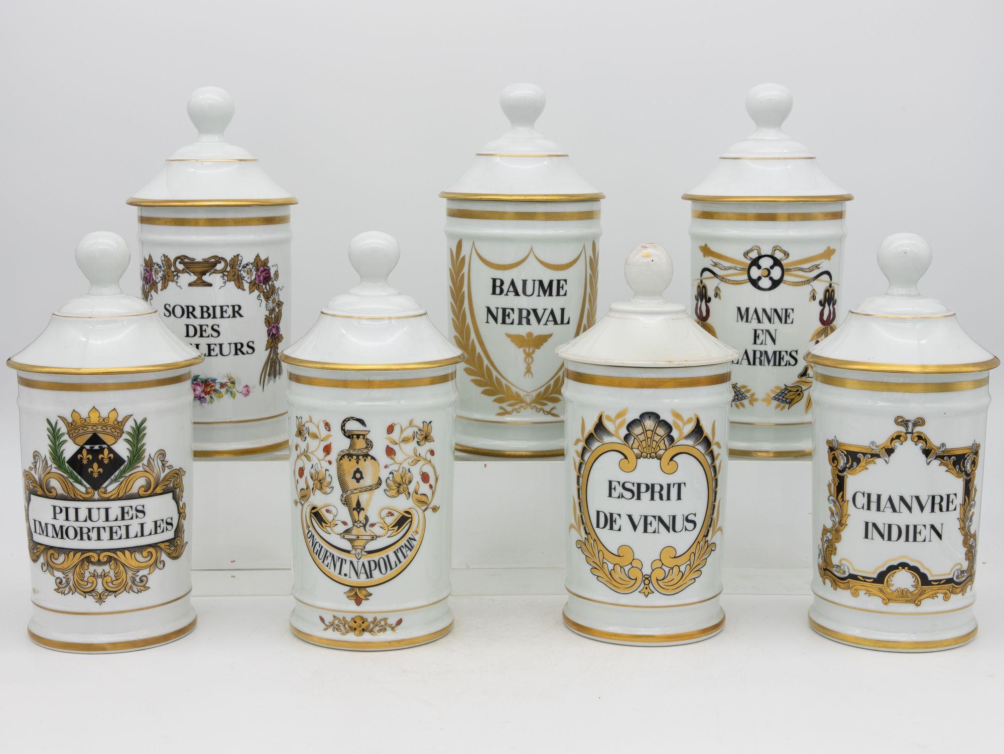 A collection of seven apothecary jars with black and gold painted labels. Each painted apothecary or pharmacy jar has a name and unique design painted on it. The collection is Mid 20th century and each has its lid. The smallest measures 4.5