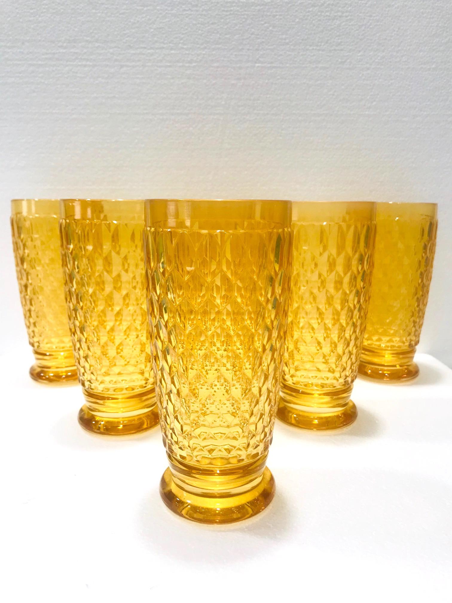 Set of seven vintage crystal highball glasses from Villeroy & Boch, Germany. Handcrafted glasses comprised of hobnail crystal with a Classic diamond pattern and with rounded bases. In gorgeous amber yellow colored glass, making them a unique and