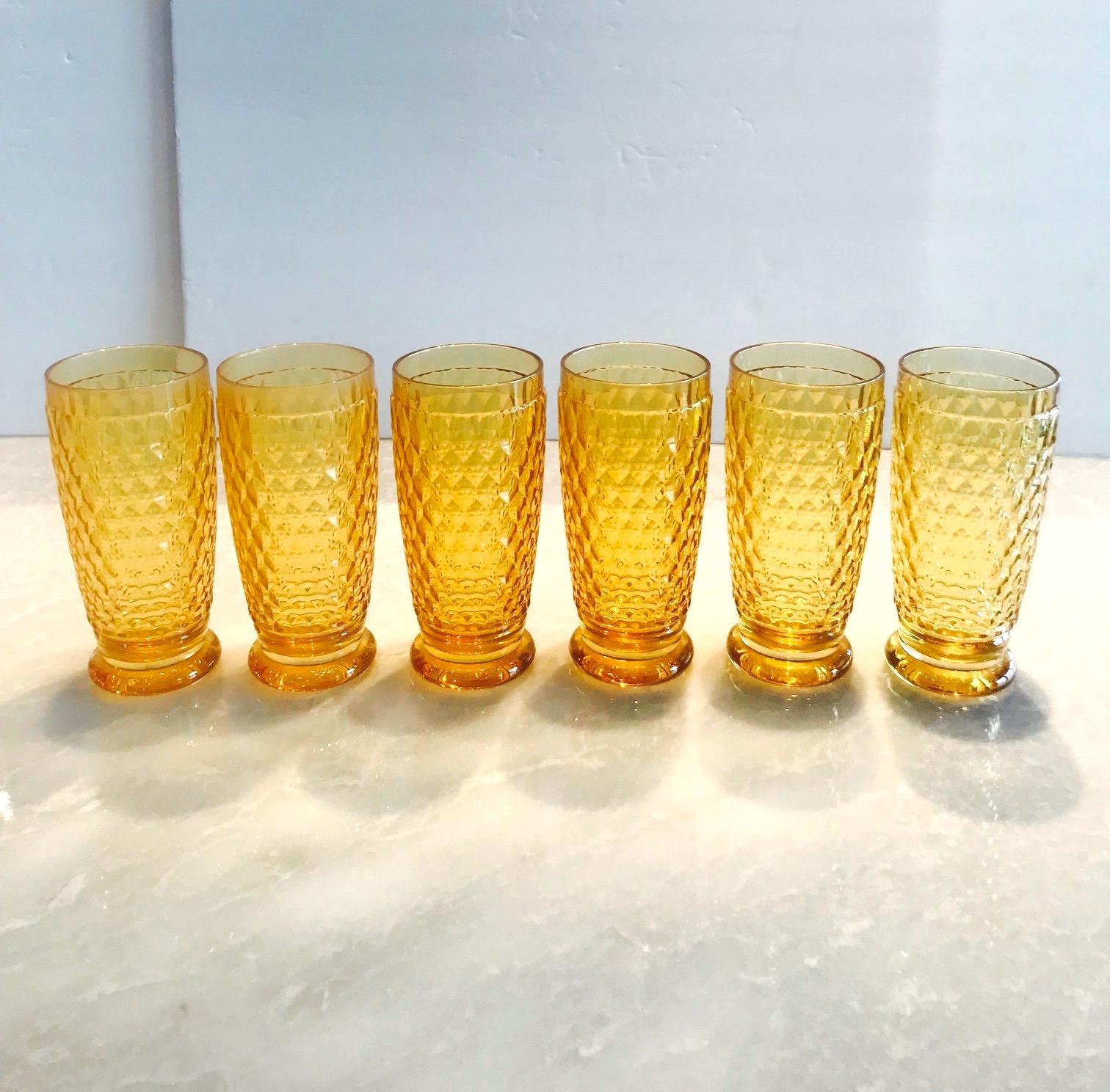 Set of seven luxury crystal highball barware glasses from Villeroy & Boch's Boston series. The glasses are comprised of hobnail crystal with Classic diamond patterns and smooth rounded bases. In gorgeous amber colored crystal, making them a unique