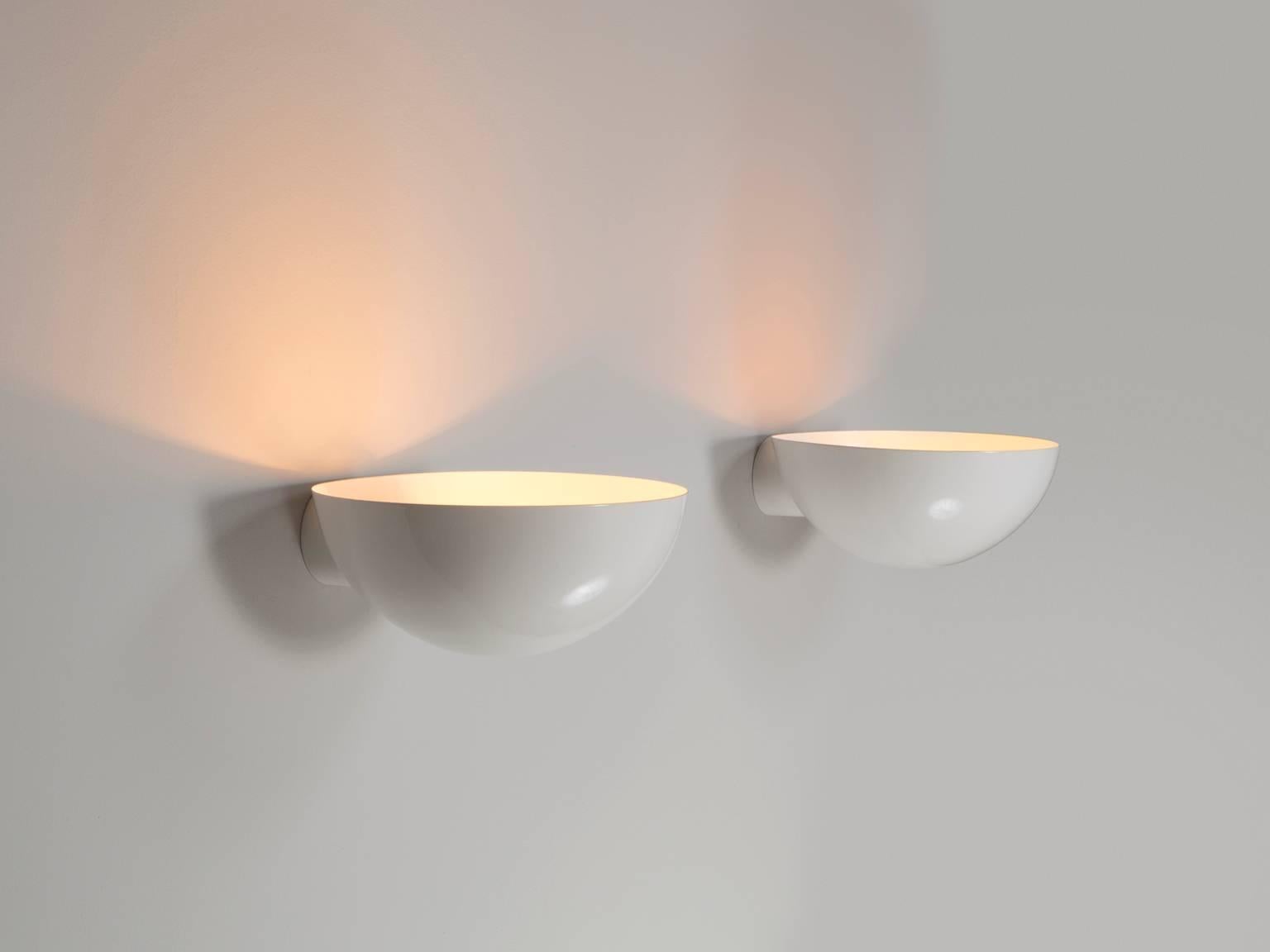 Set of wall lights, metal, 1970s.

Interesting set of 6 curved wall sconces finished in white lacquered metal.
The semi spheres nicely spread the light upwards.

Dead stock, so these lights have never been used (brand new, but produced in the