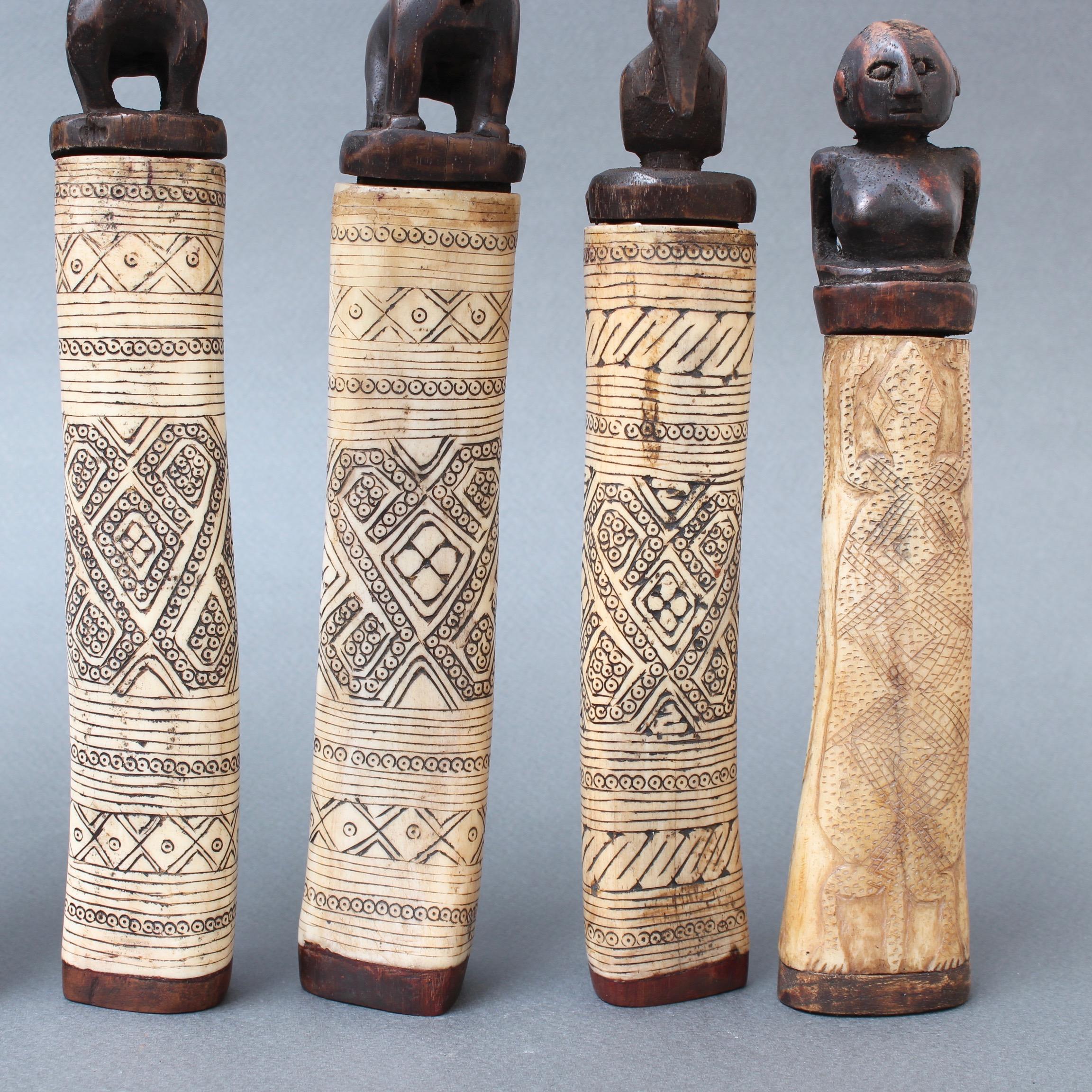 20th Century Set of Seven Wood and Bone Lime Powder Holders for Betel Nut from W. Timor