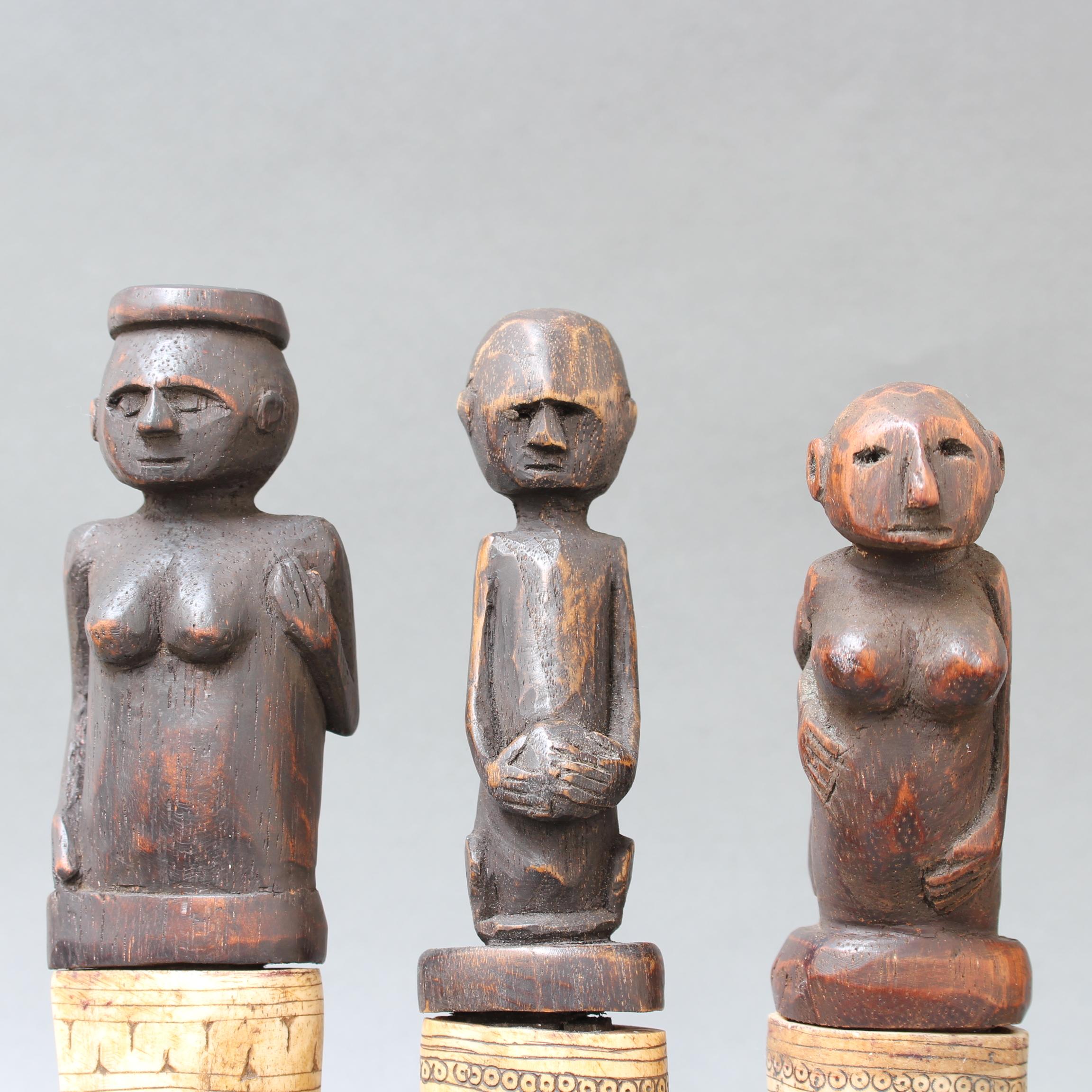 Set of Seven Wood and Bone Lime Powder Holders for Betel Nut from W. Timor 1