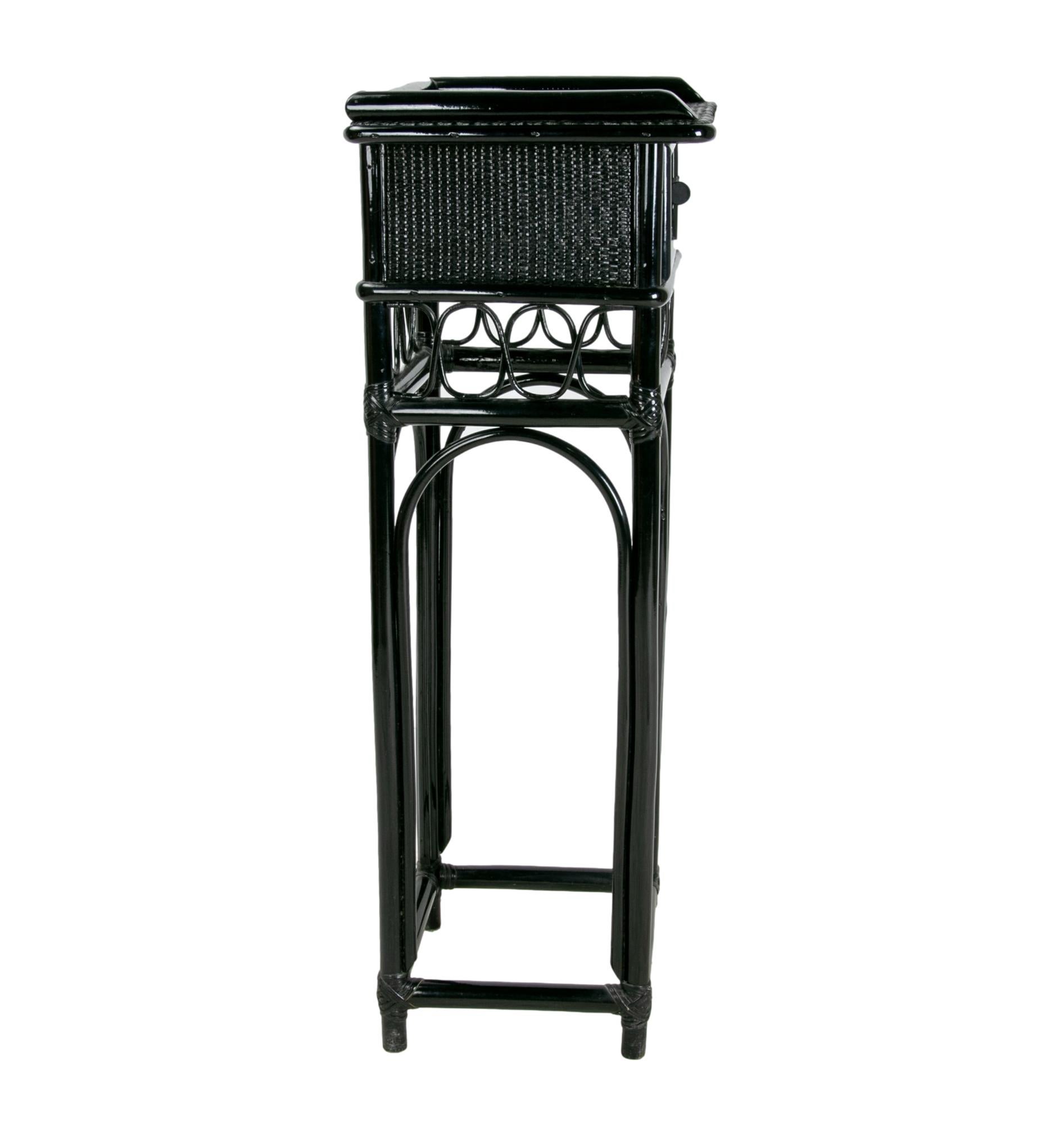 `Set of side tables and mirror in bamboo and wicker lacquered in black 
Table measurements: 98 x 36 x 36 cm.