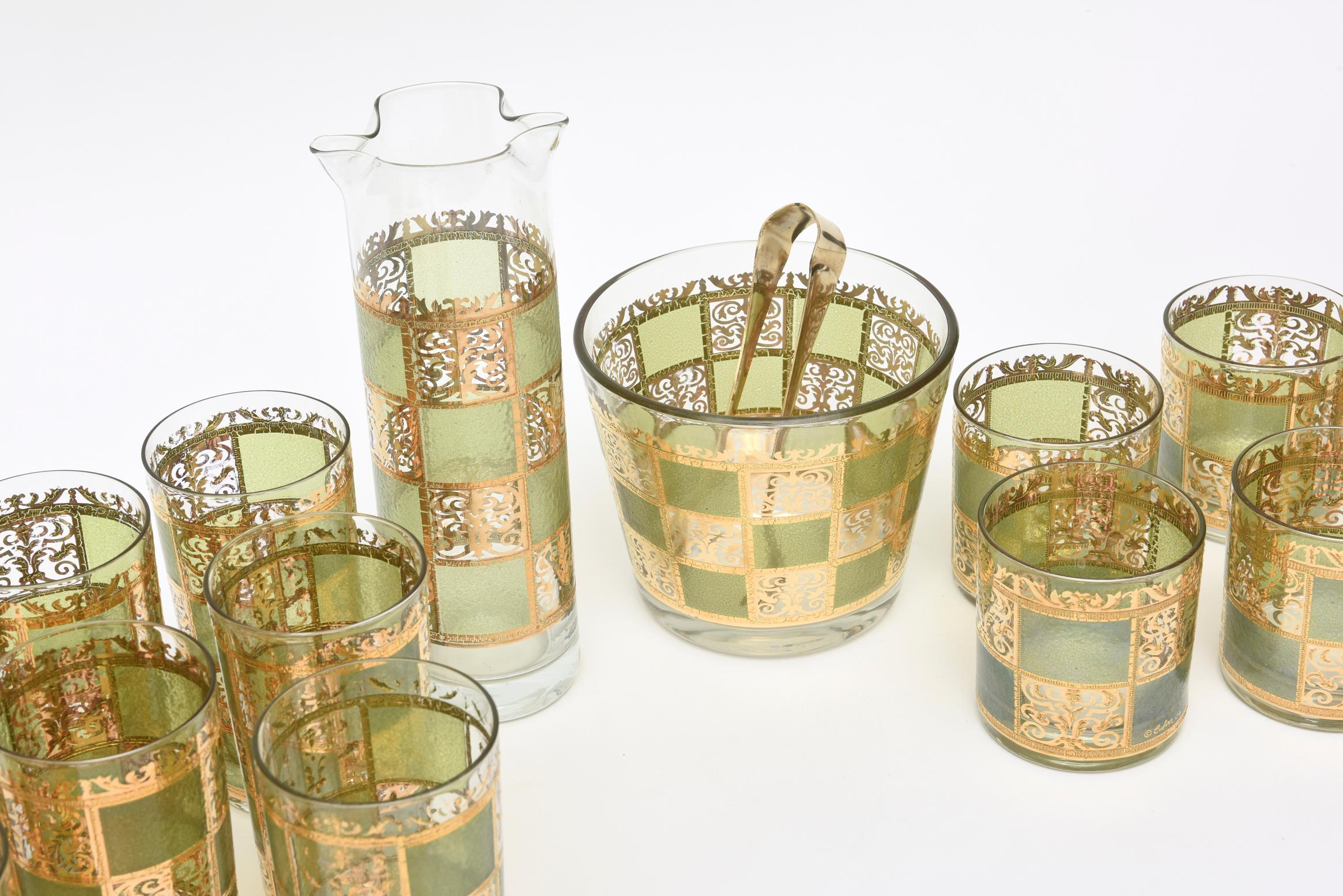 This wonderful set of Mid-Century Modern barware is signed Culver. It is 22-carat gold painted with a beautiful color of green squares. The collection includes a carafe, an ice bucket with original thongs, 7 highballs and 6 rock glasses. There are