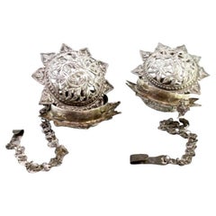 Set of silver air fresheners with reliefs and hanging chains