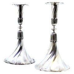 Set of silver candlesticks with embossed stems and cut-out sconces