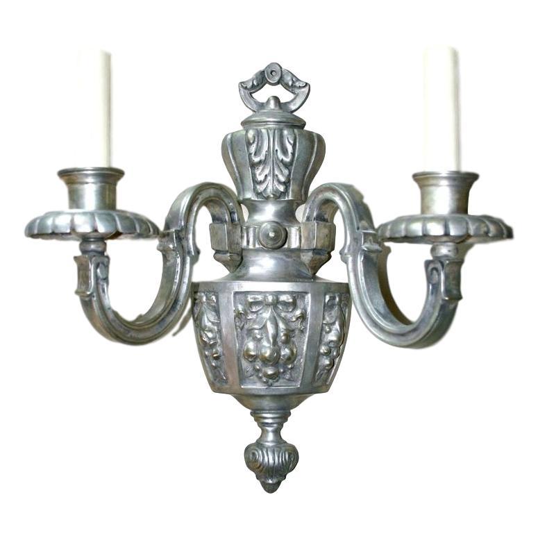 Set of eight circa 1920s American silver plated bronze sconces with fruit and foliage motif. Sold per pair.

Measurements:
Height 14