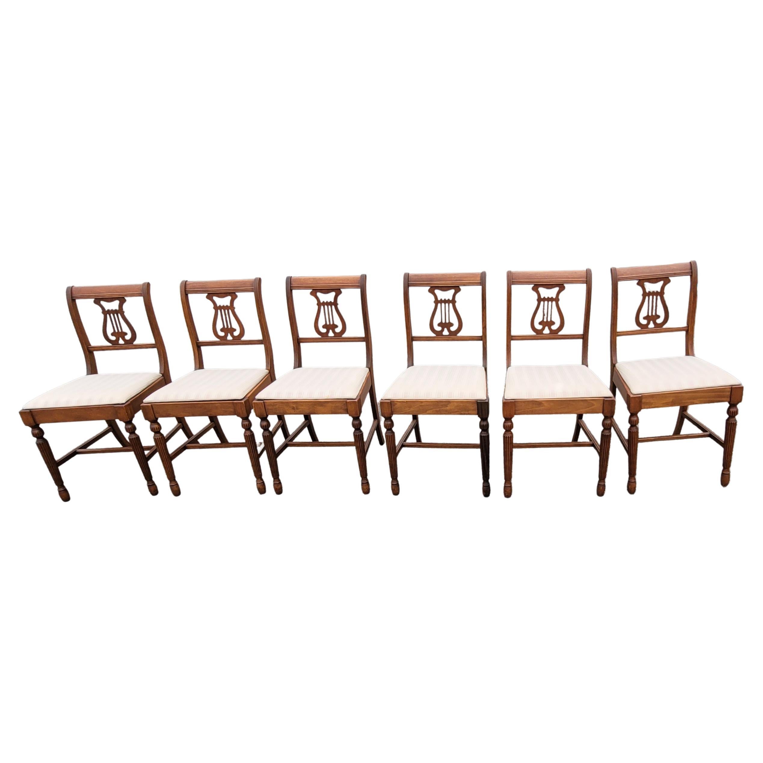 Set of six 1930s refinished Lyre-Back mahogany and upholstered dining chairs. Newer upholstery. Beautiful hand rub finish appearance. Measure 17