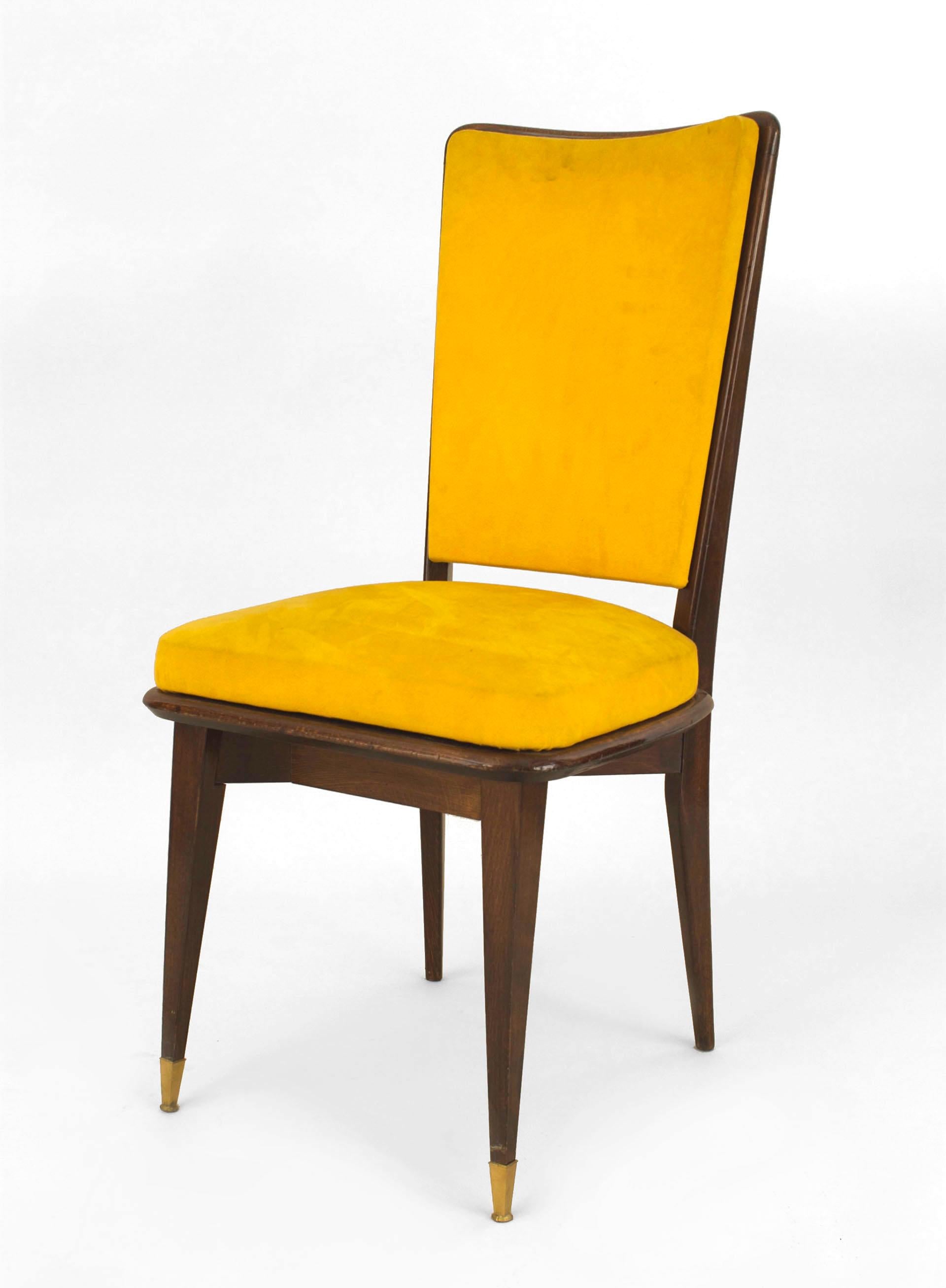Set of six French, 1940s ebonized side chairs with a shaped yellow upholstered back and seat with bronze sabot feet (attributed to Jansen).

Maison Jansen was a Paris-based interior decoration office founded in 1880 by Dutch-born Jean-Henri Jansen.