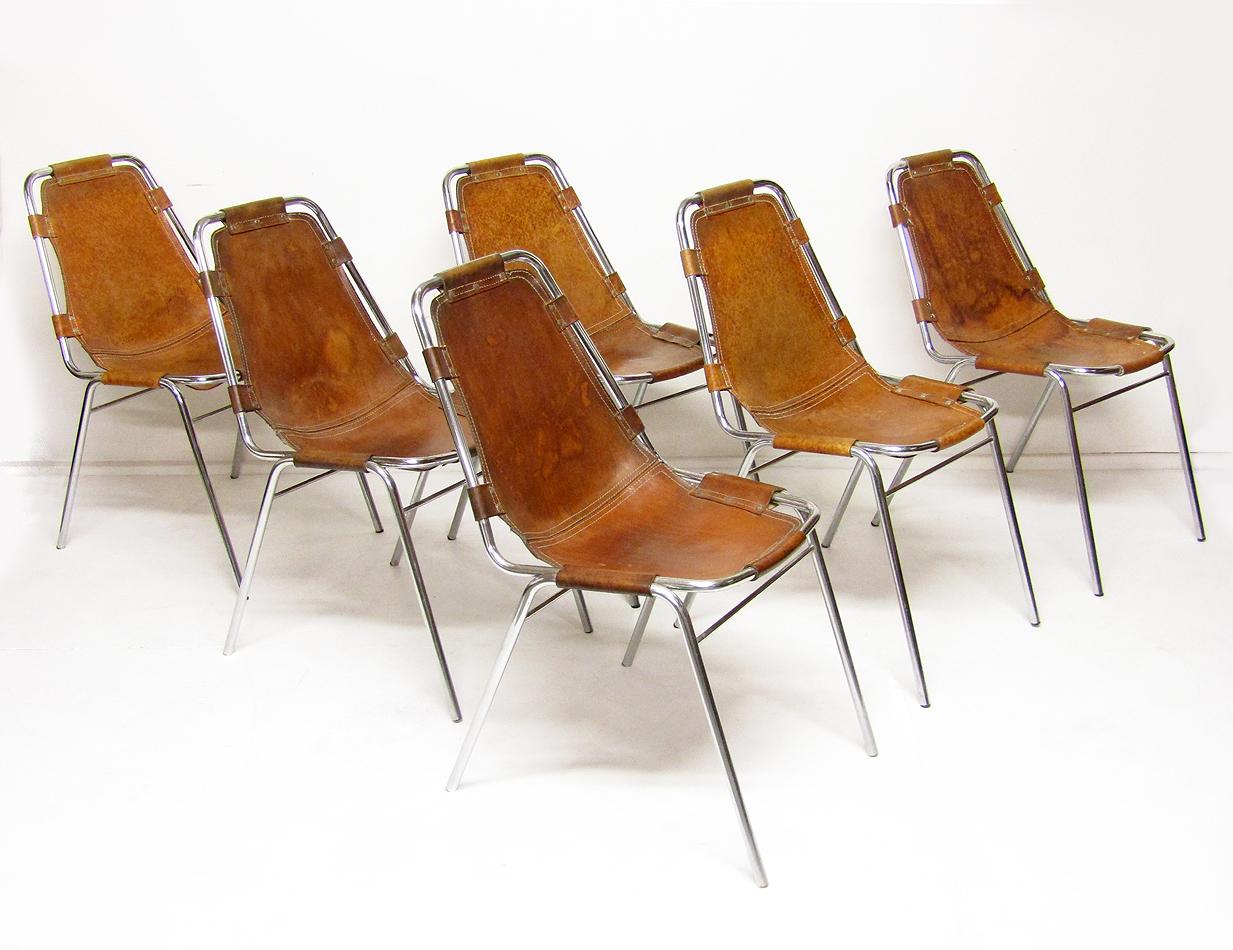 A set of six early 1960s hide and chromed steel chairs by Cassina, as selected by Charlotte Perriand for the 