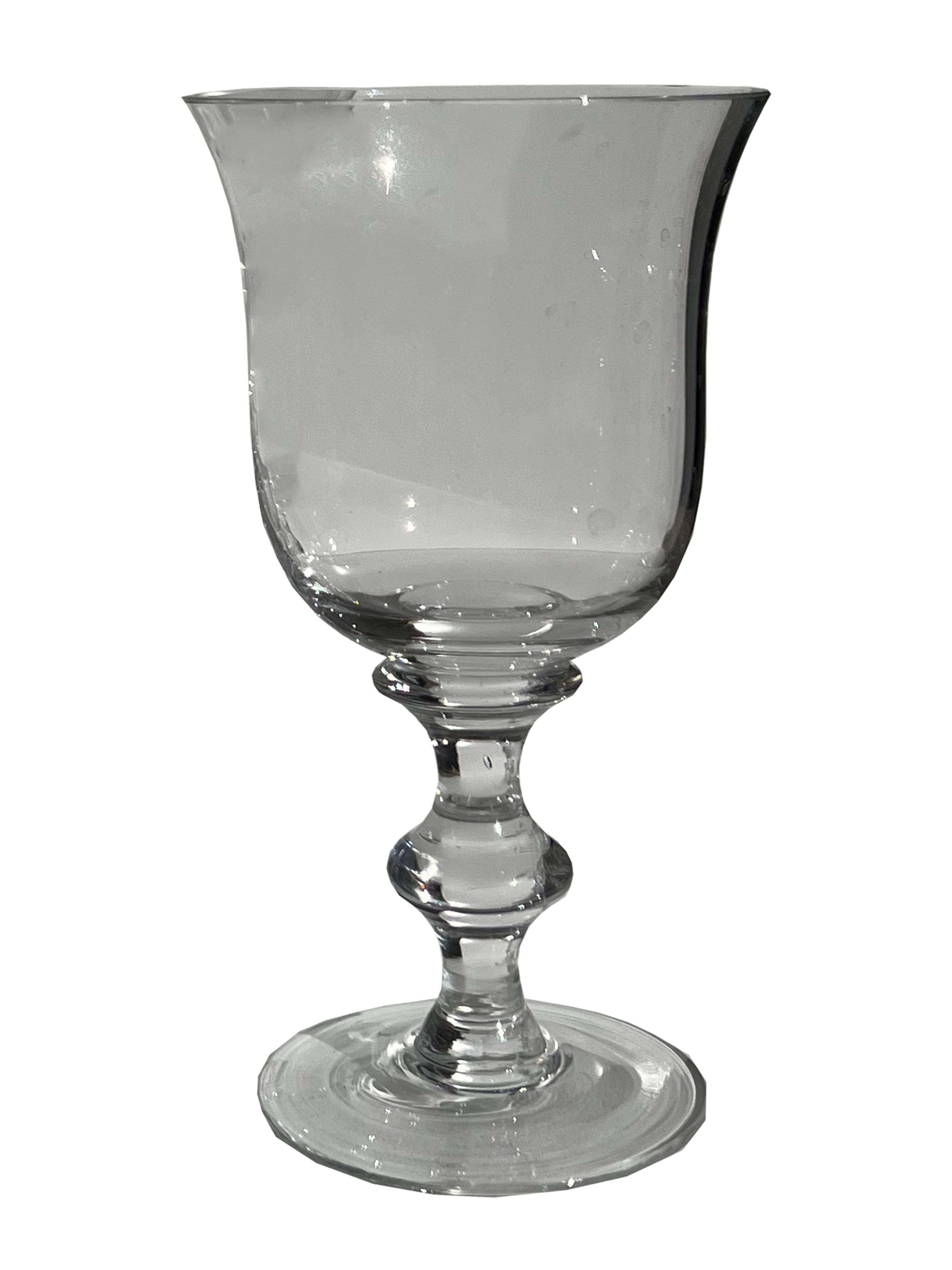 Indulge in the charm of vintage tableware with our set of 6 glass wine goblets, perfectly designed to enhance your wine-drinking experience. These glasses feature a wide fluted rim, providing a comfortable resting place for your lips as you savor