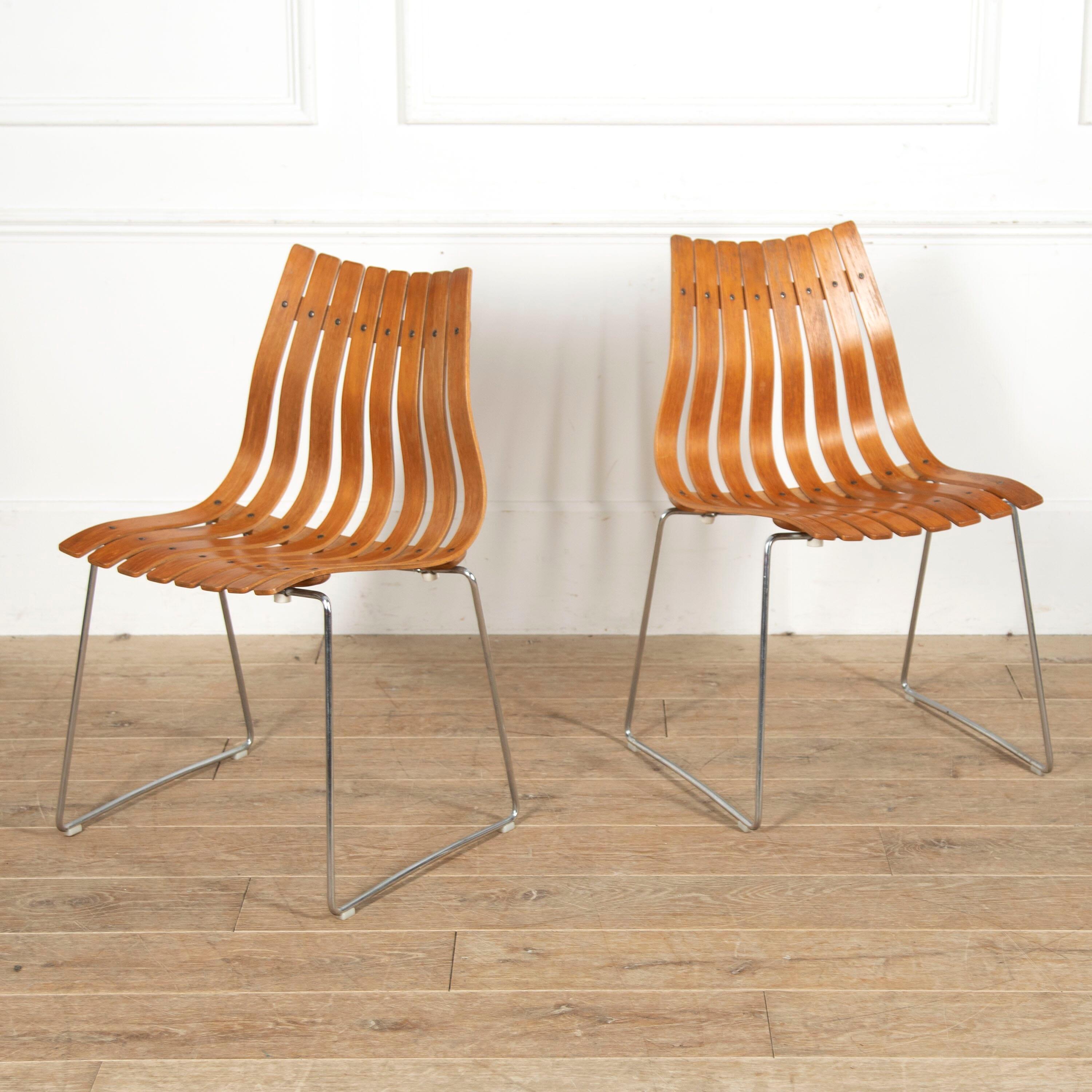 Stunning set of six 'Scandia' dining chairs, designed by Hans Brattrud in 1957 for Hove Møbler.

These iconic chairs with their broadening backs comprise laminated rosewood slats supported on a chrome frame.

Hans Brattrud was a Norweigan