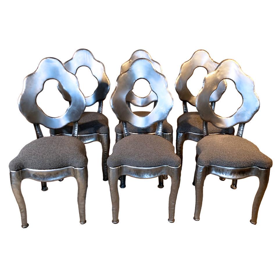 Set of six utterly idiosyncratic hand-forged steel Mid-Century Mod Brutalist chairs found near the Hudson River. Dating to the 1970s, they are the bespoke work of a custom shop, probably working for a designer. The form combines elements of Louis